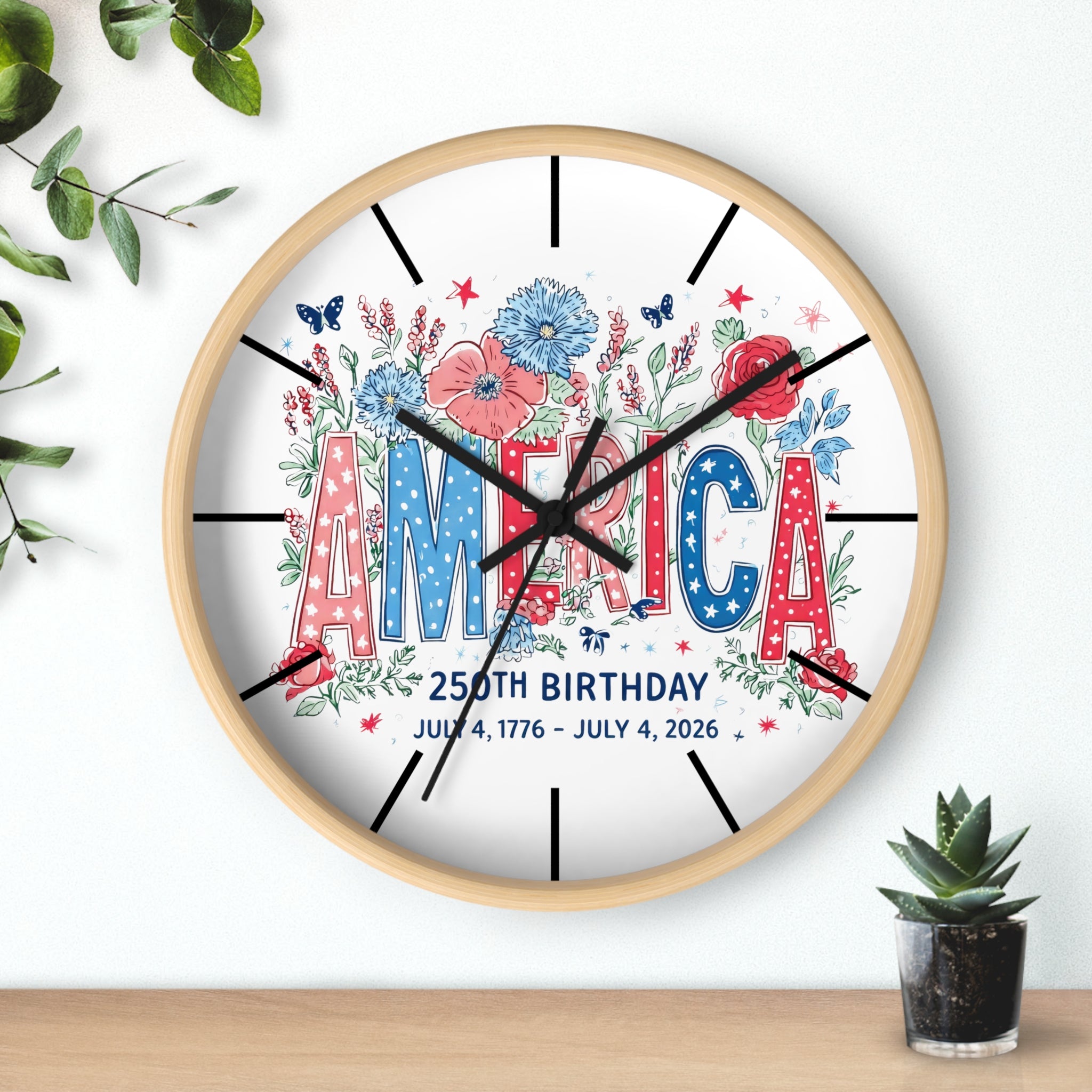 Decorative wood wall clock with 'America' and floral design on a white background