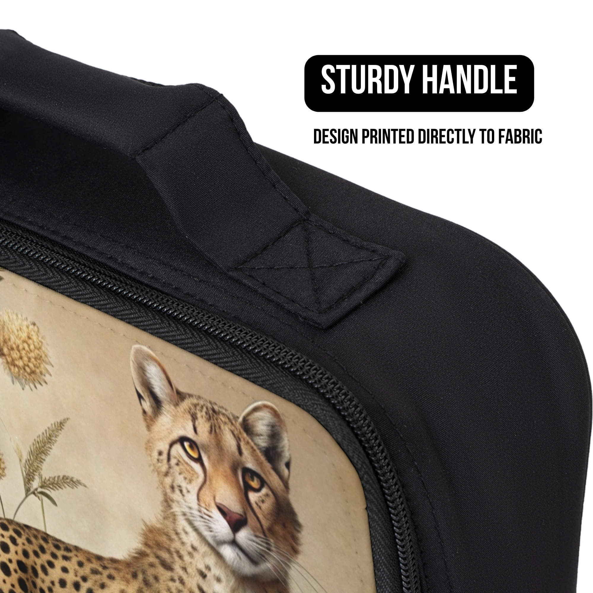 close up of a black lunch bag with a cheetah design printed directly to the fabric and a sturdy handle.