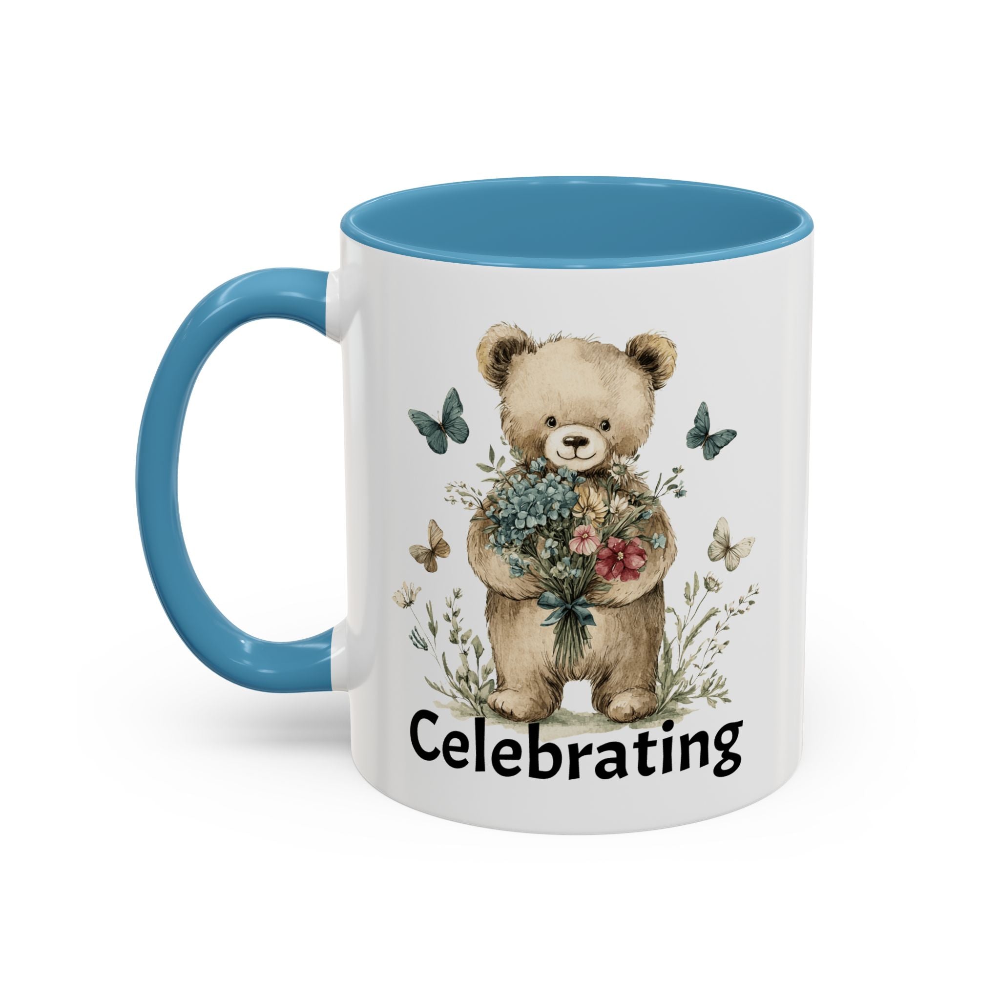 Mug with a teddy bear holding flowers and the word 'Celebrating', blue handle and interior.