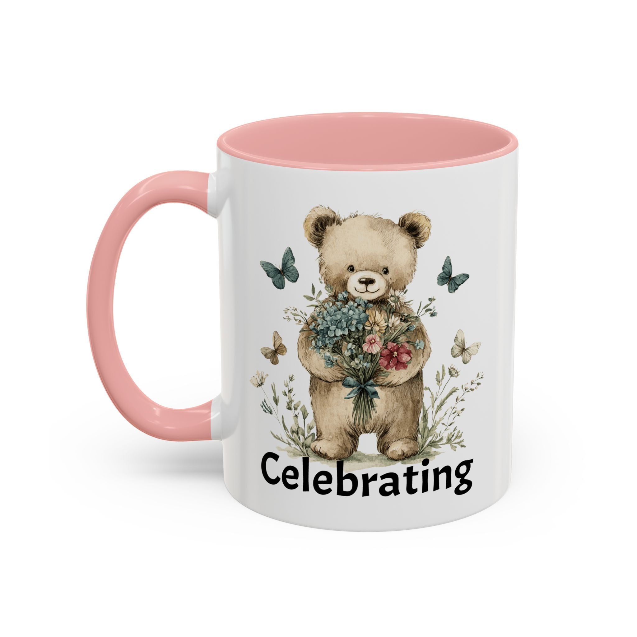 Mug with a teddy bear holding flowers and the word 'Celebrating', pink handle and interior.