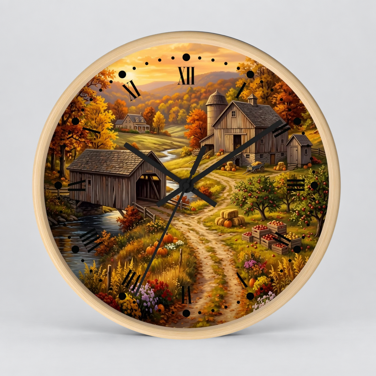 Round wall clock with a light wood frame and a scenic autumn farm illustration on the dial, featuring a barn, covered bridge, dirt path, flowers, and Roman numeral hour markers.