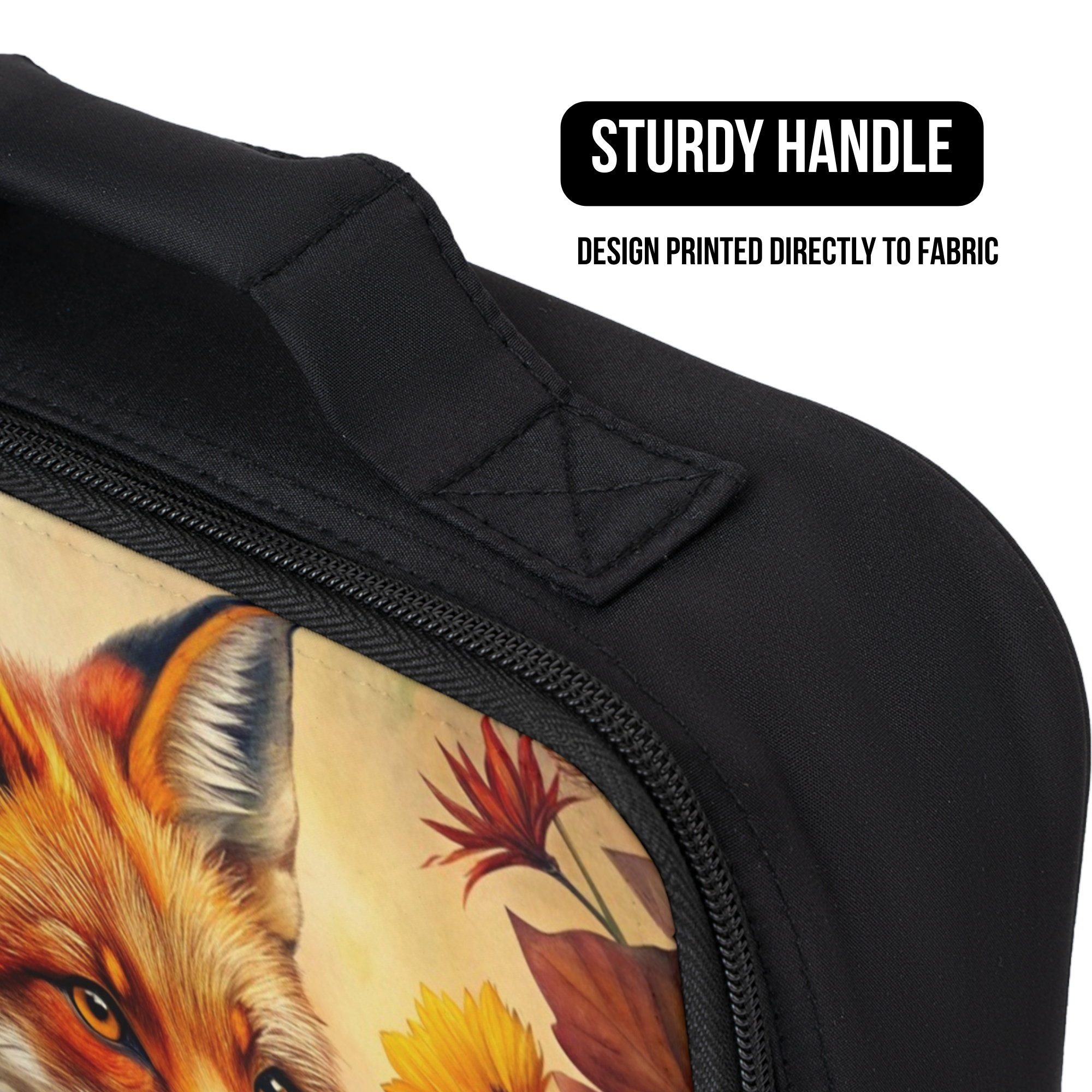 close up of a black lunch bag with a fox design printed directly to the fabric and a sturdy handle. 