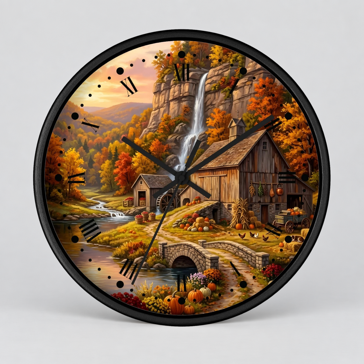 Round wall clock with a black frame and hands, featuring a detailed autumn landscape illustration with a waterfall, rustic barn, stone bridge, pumpkins, and fall foliage on a light gray background.