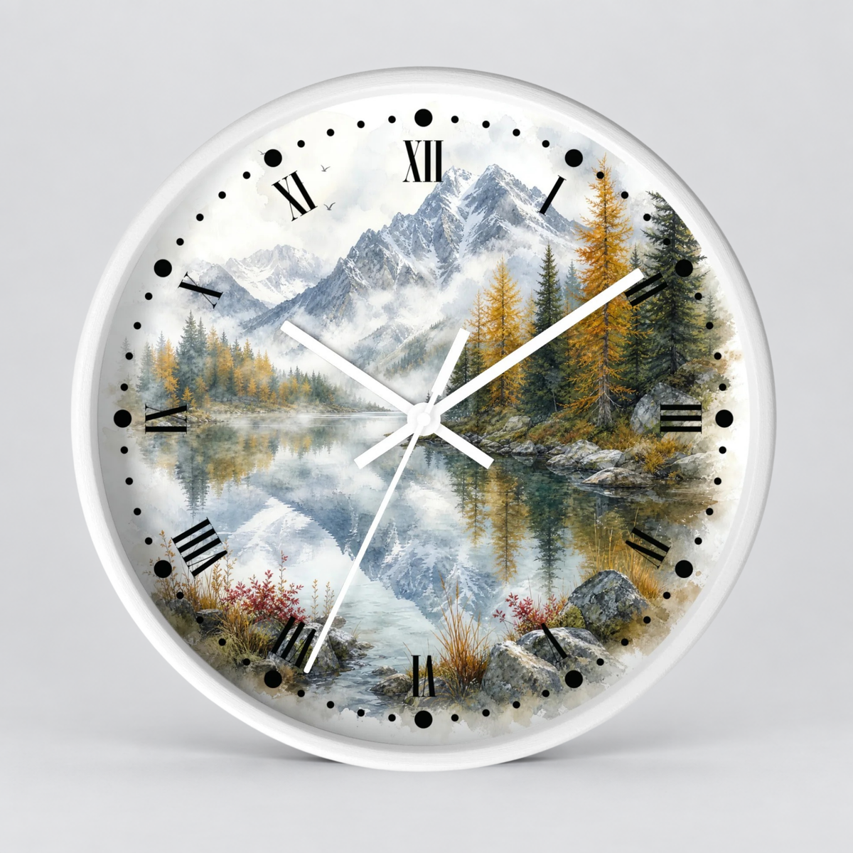 A round wall clock with a white frame and a scenic landscape print featuring mountains, pine trees, a reflective lake, and Roman numerals on a light gray background.