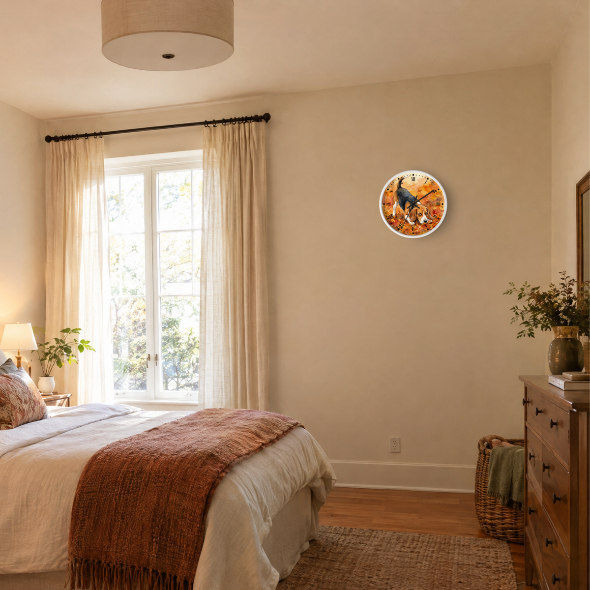 A round wall clock with a colorful autumn beagle dog illustration hangs on a beige wall in a styled bedroom with a bed, window, curtains, and wooden dresser.