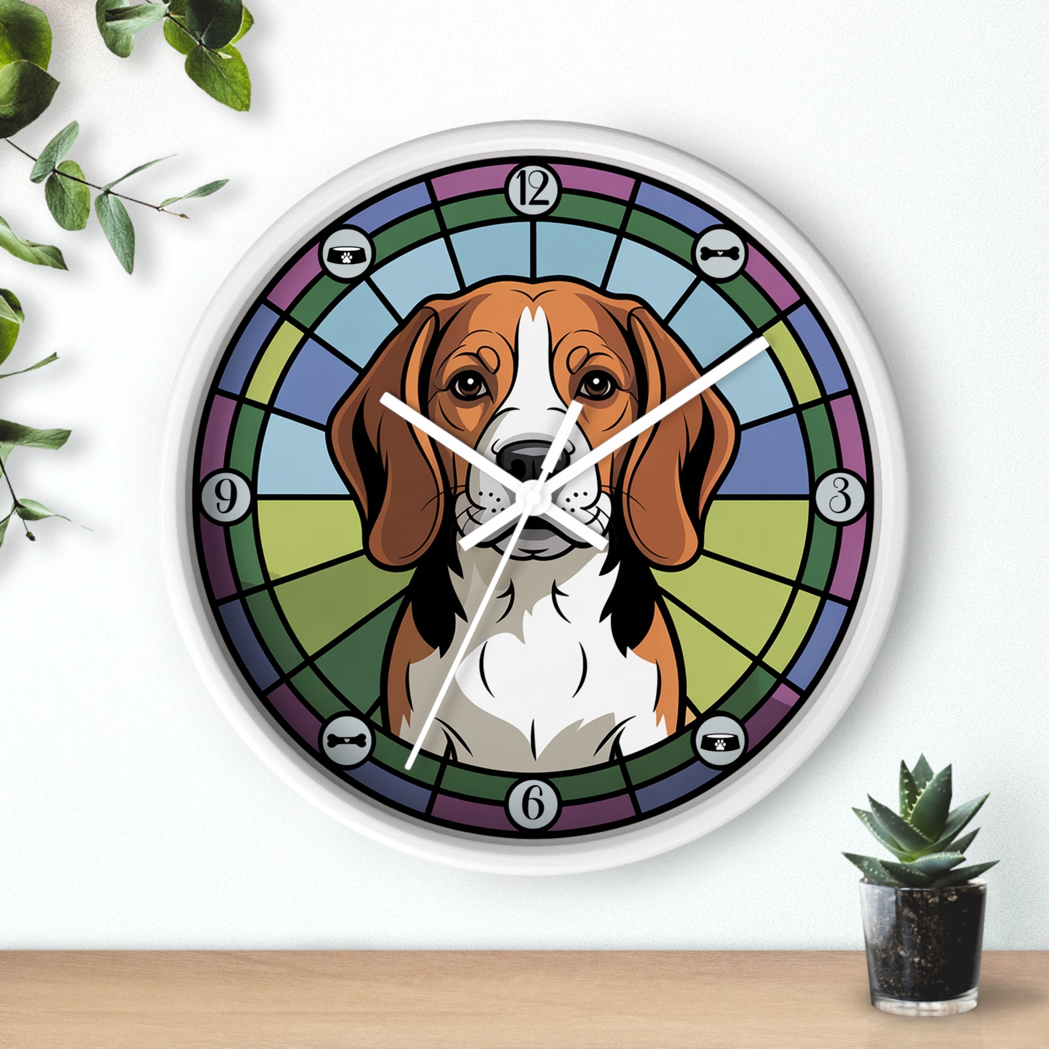 Wall clock with a beagle dog illustration on a colorful background, placed on a wooden surface with plants.
