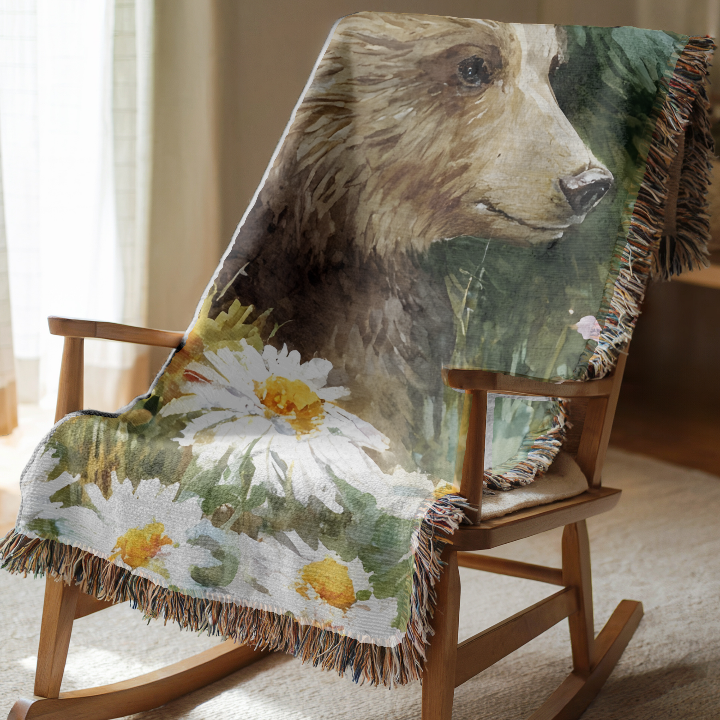 Cotton woven blanket with bear and floral design draped over a wooden rocking chair