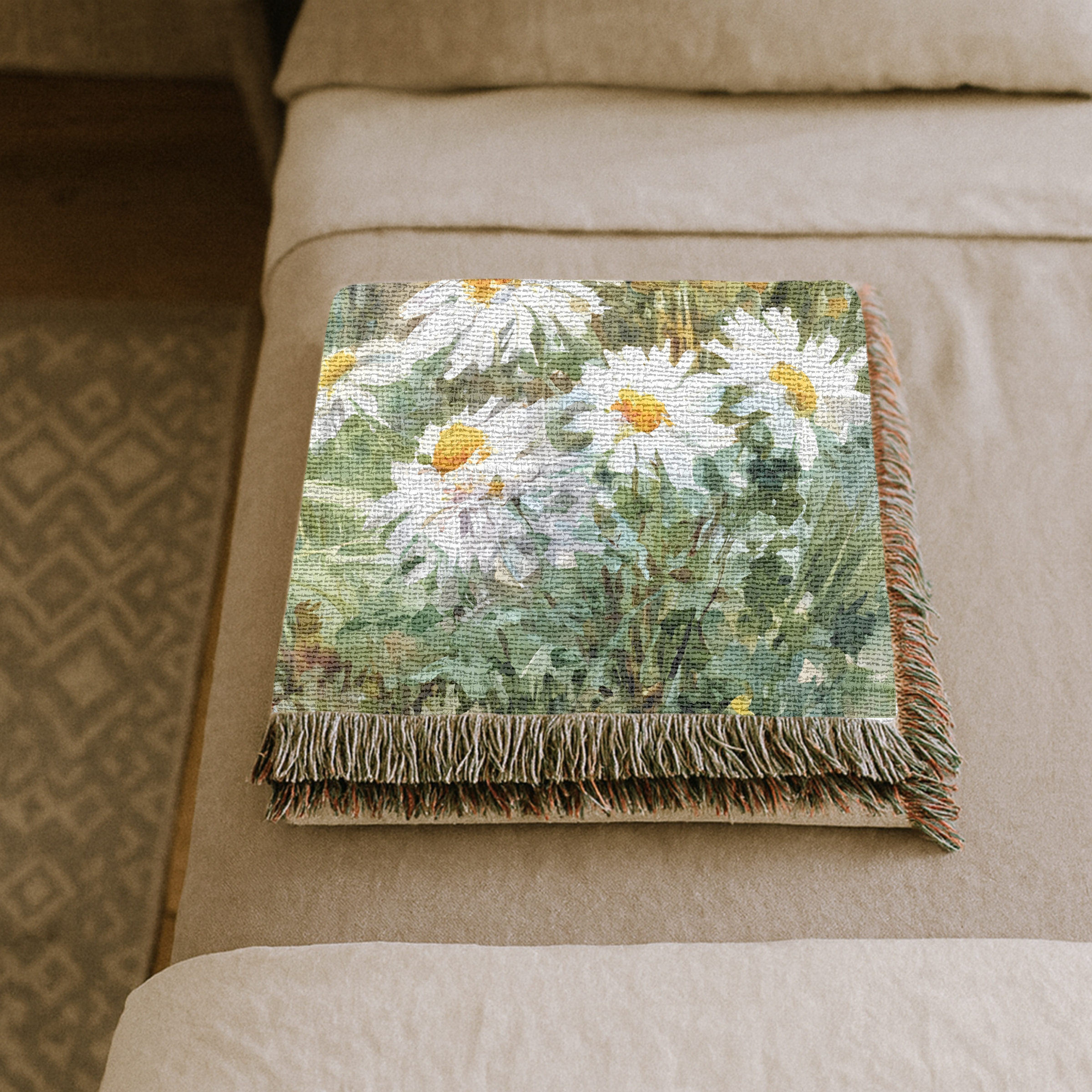 Floral-patterned throw blanket on a beige bed