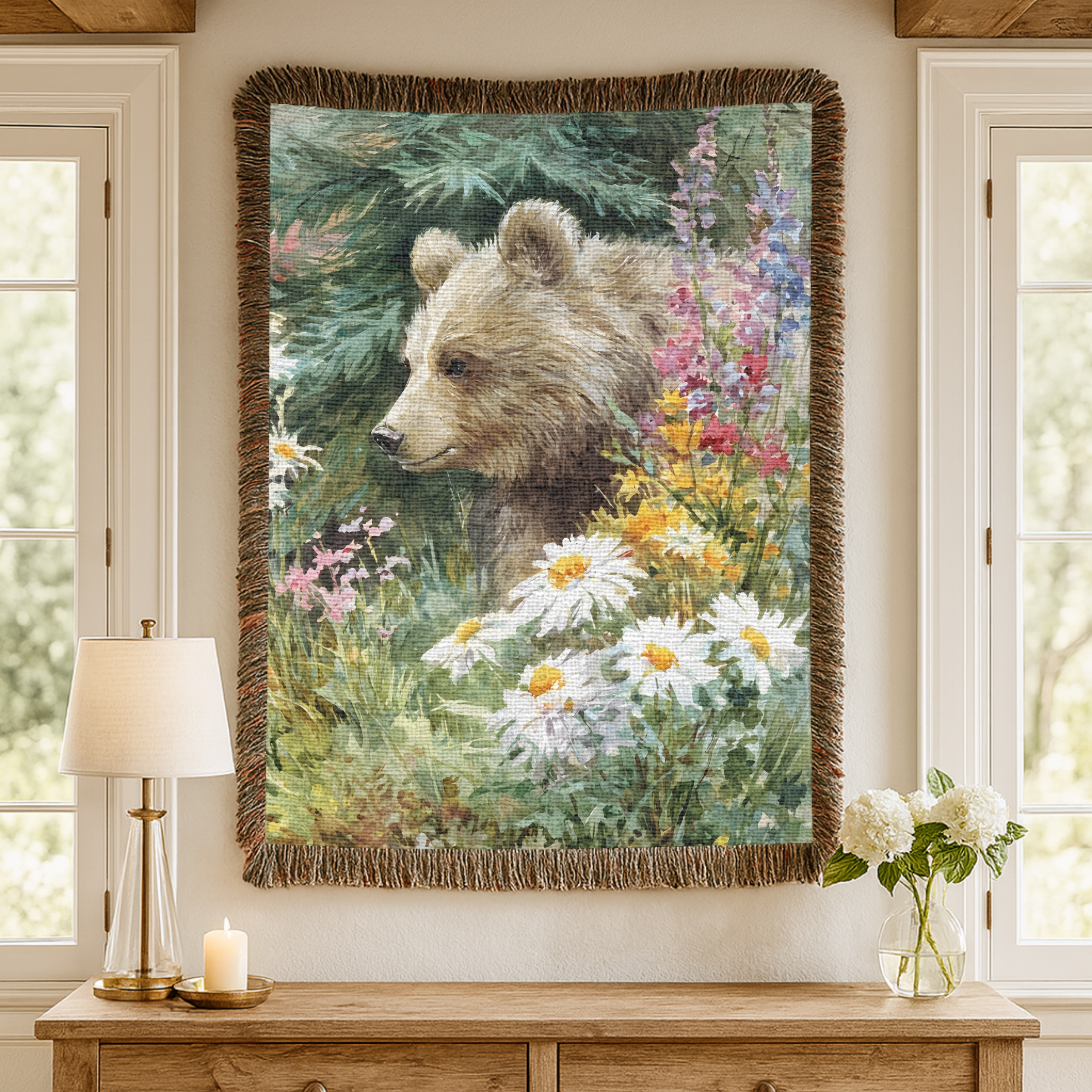 Woven tapestry of a bear in a forest scene hanging on a wall above a wooden console table.