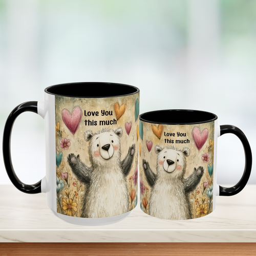 Two black accent mugs (15oz. & 11oz.) with bear illustrations and 'Love you this much' text on a blurred green background