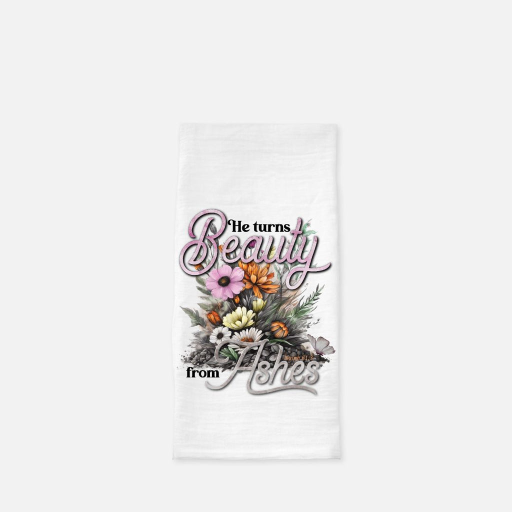 White tea towel with floral design and text on a white background
