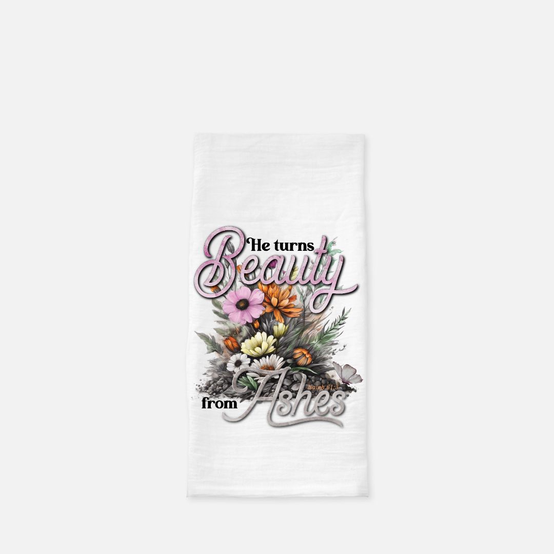 White tea towel with floral design and text on a white background