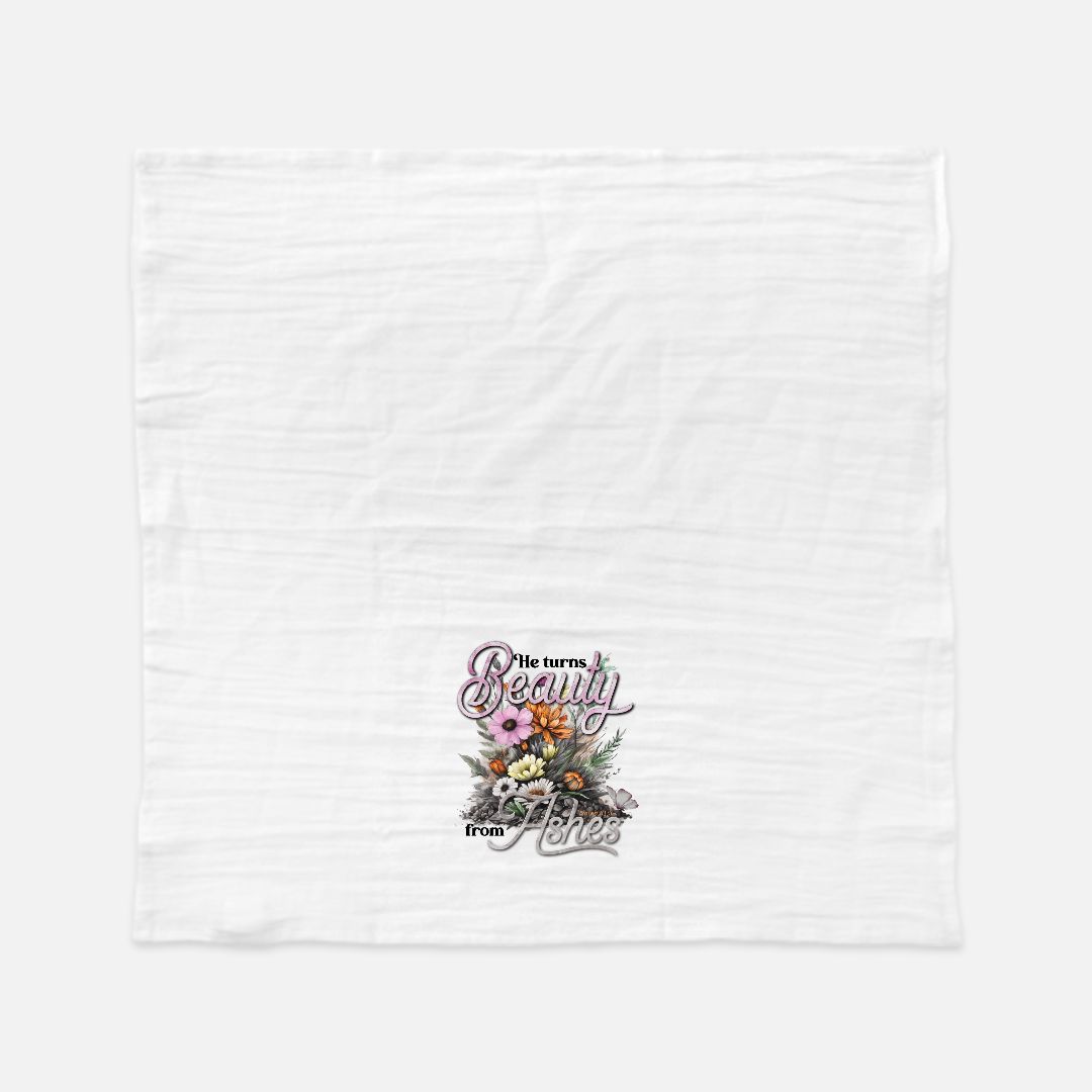 White tea towel with floral design and text on a white background