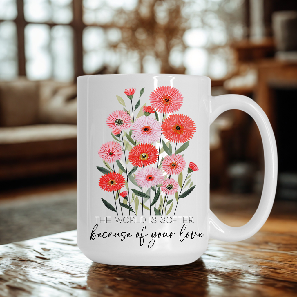 White 15oz mug with floral design and text on a wooden table