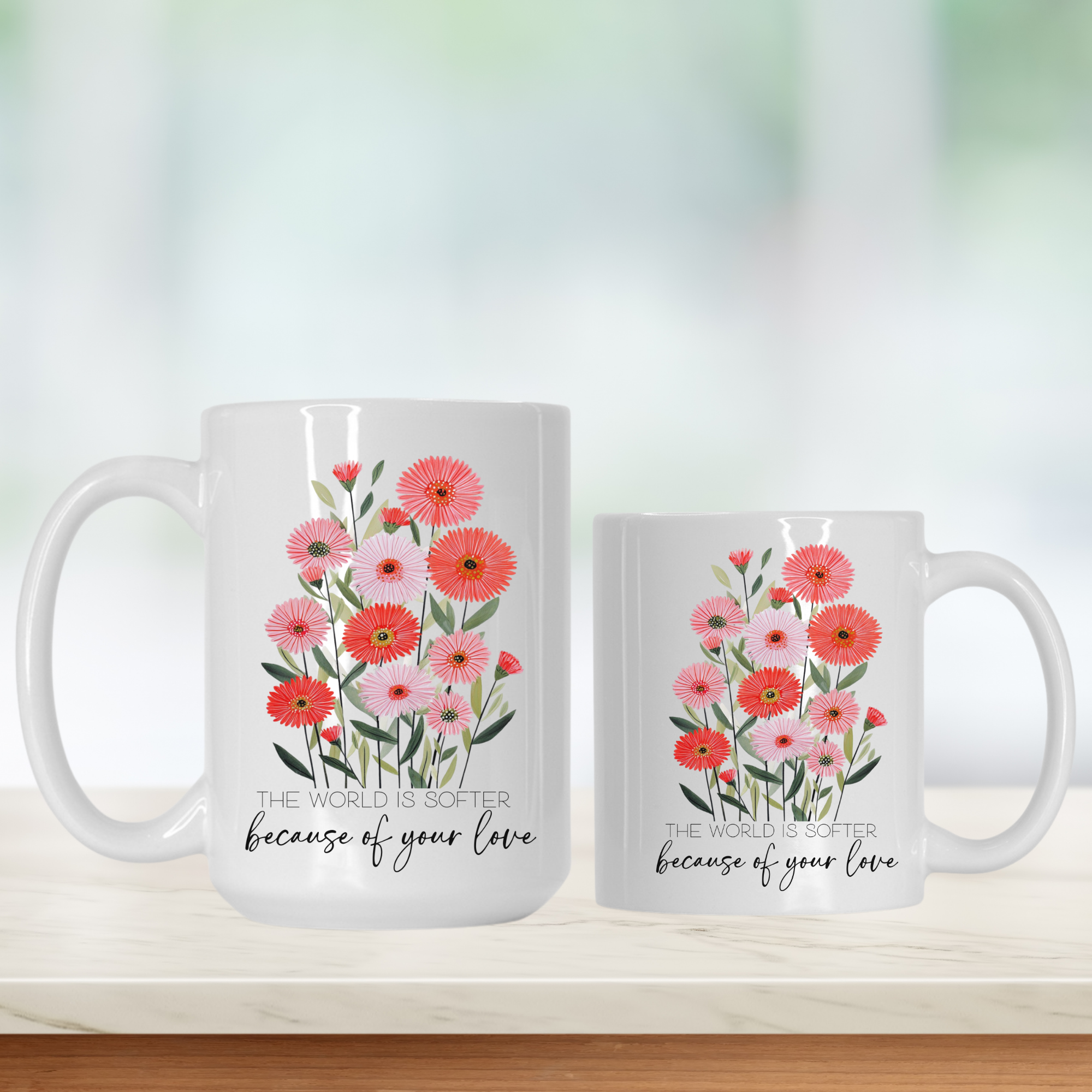 15oz & 11oz mugs with floral designs and text 'The world is softer because of your love' on a white surface.