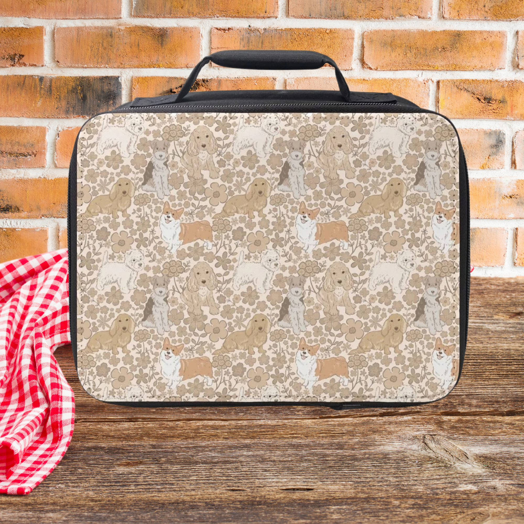 Lunch bag with dog & floral  pattern on a wooden picnic table and brick wall background