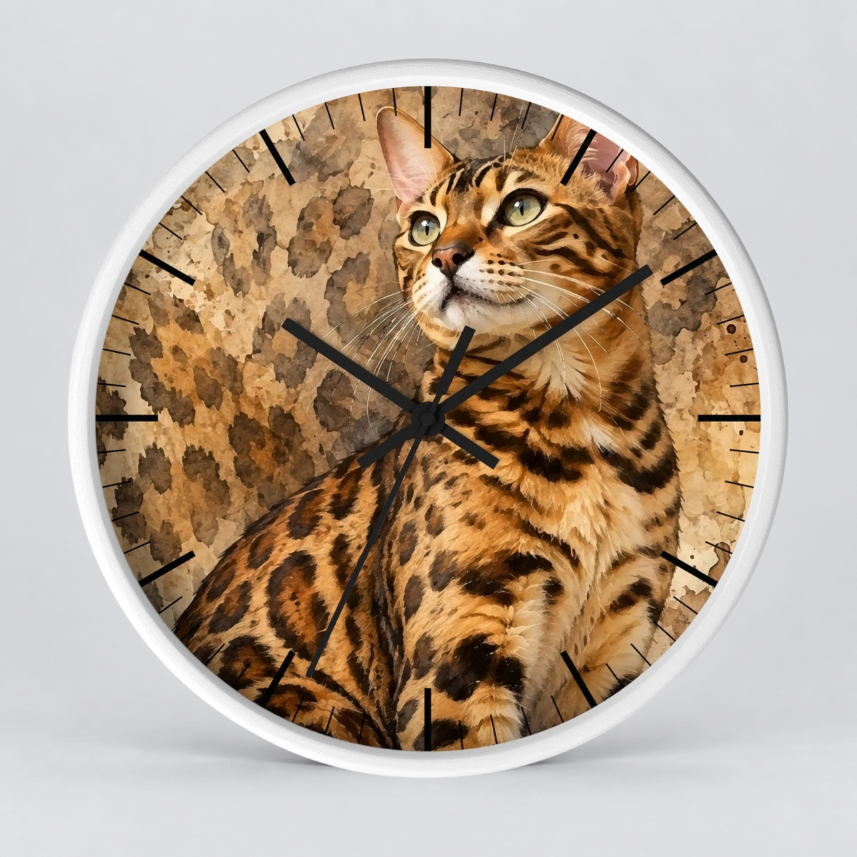 Round wall clock with a white frame and a printed cat face and spotted animal-pattern face, shown against a light gray background.