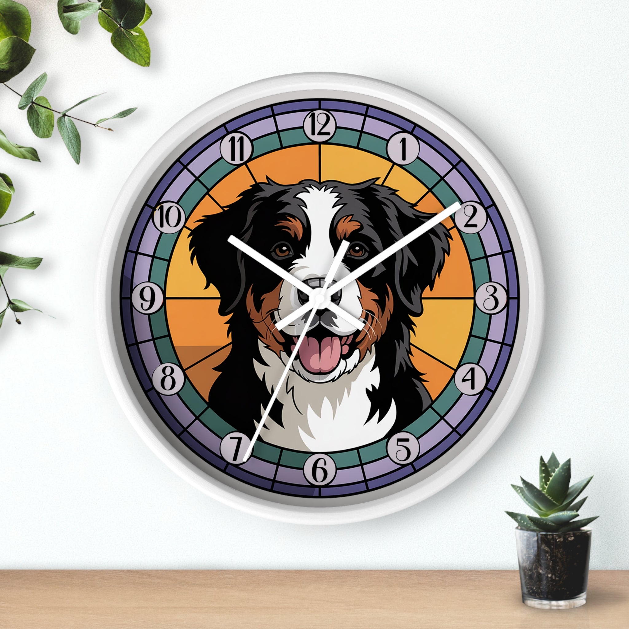 Wall clock with a dog's face design on a white wall with plants.