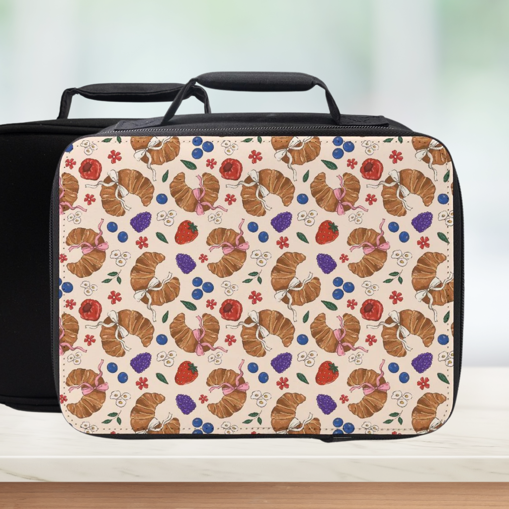 Lunch bag with a croissant and berry pattern on a light background