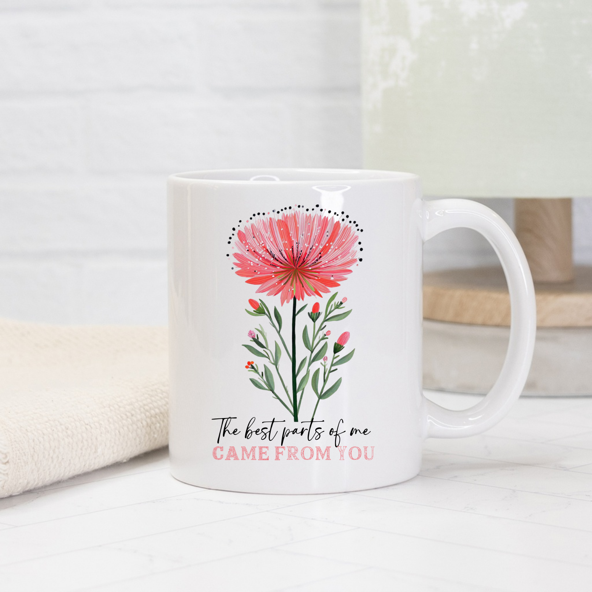White 11oz mug with pink floral design and text on a light background
