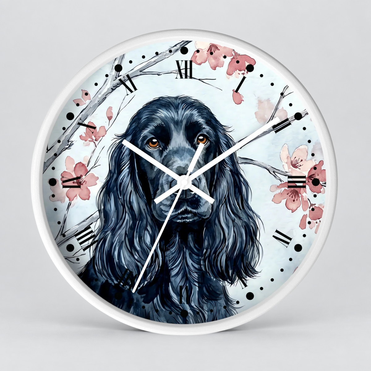 Round wall clock with a white frame and a printed illustration of a black long-haired dog surrounded by pink flowers and branch details, with black Roman numerals and white hands on a light gray background.