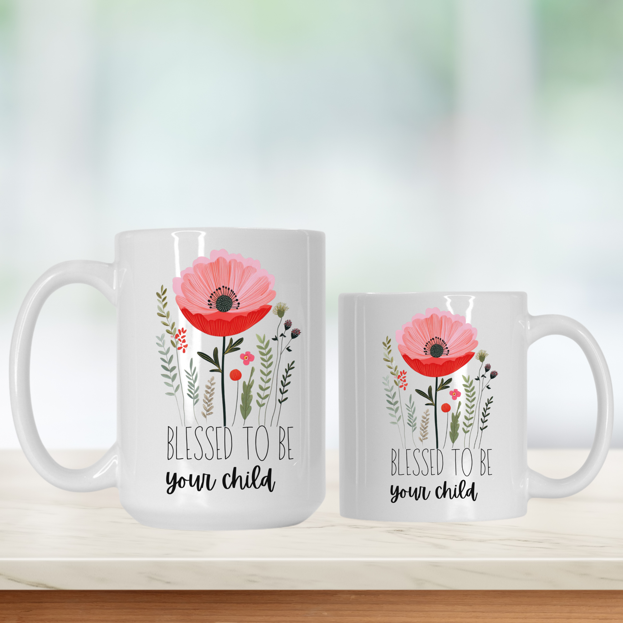 15oz and 11oz white mugs with floral designs and text 'Blessed to be your child' on a light background
