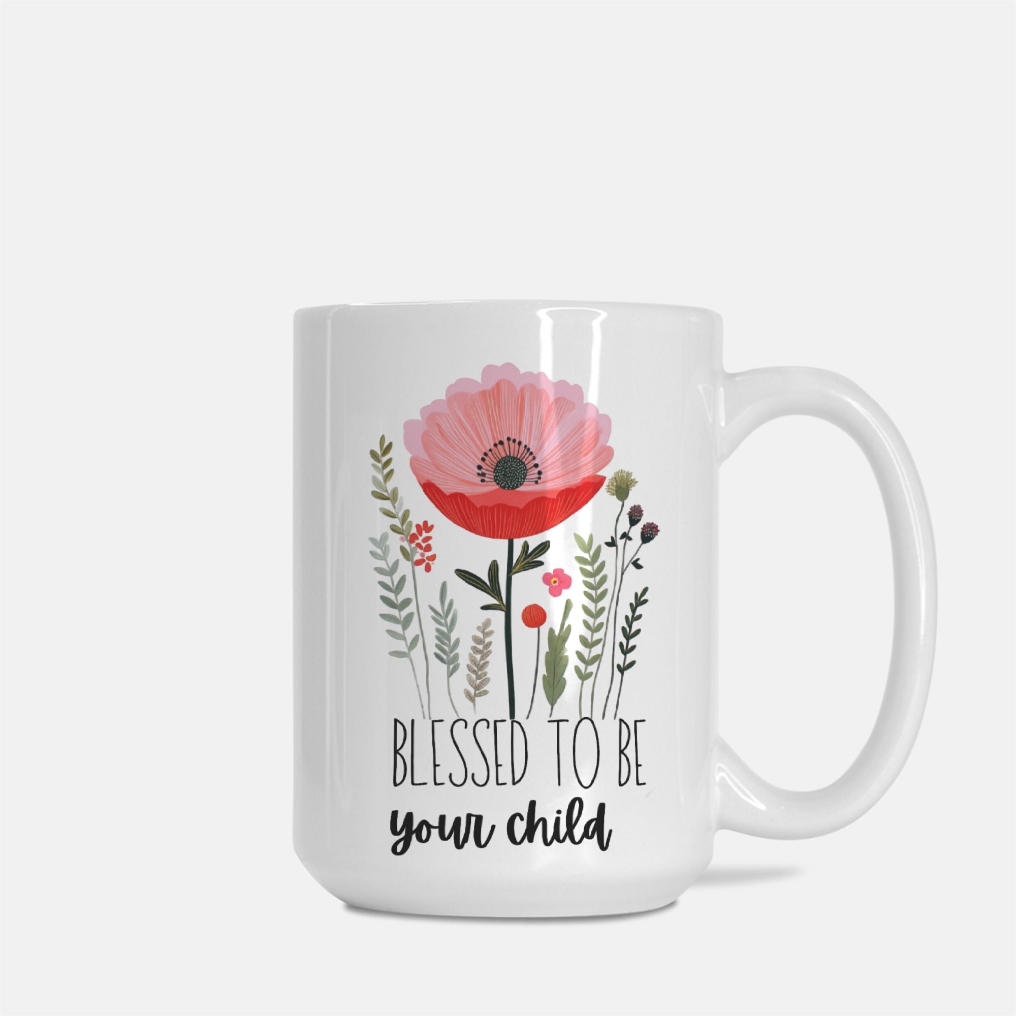 Right side of white 15oz mug with floral design and text 'Blessed to be your child' on a white background