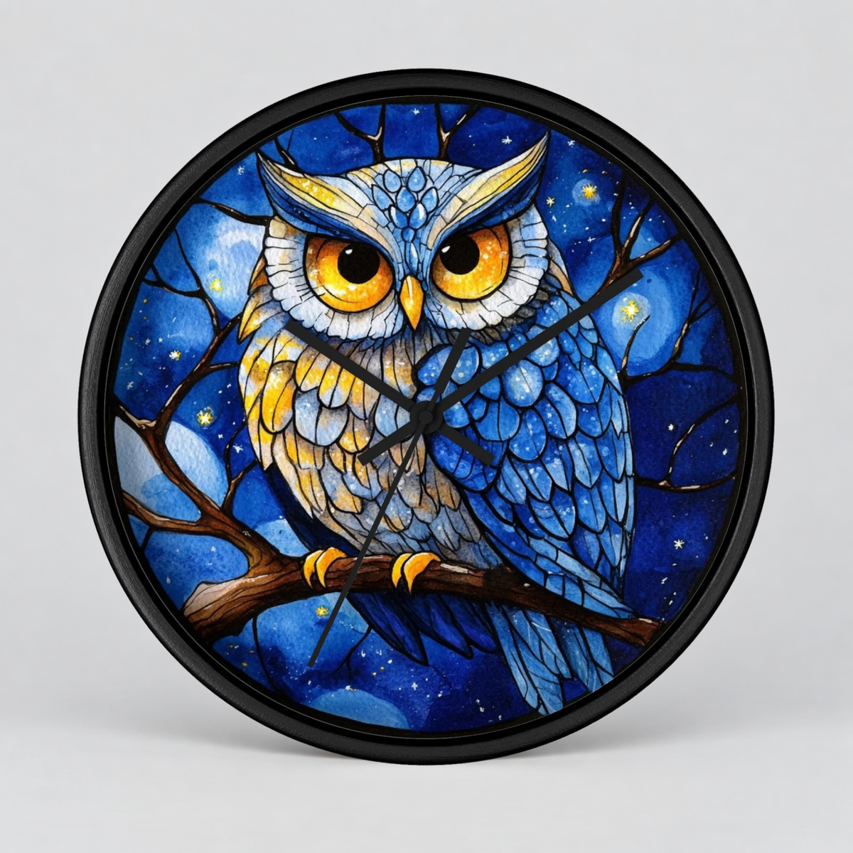Round wall clock with a black frame and a colorful stained-glass style illustration of a blue owl perched on a branch against a starry night sky.