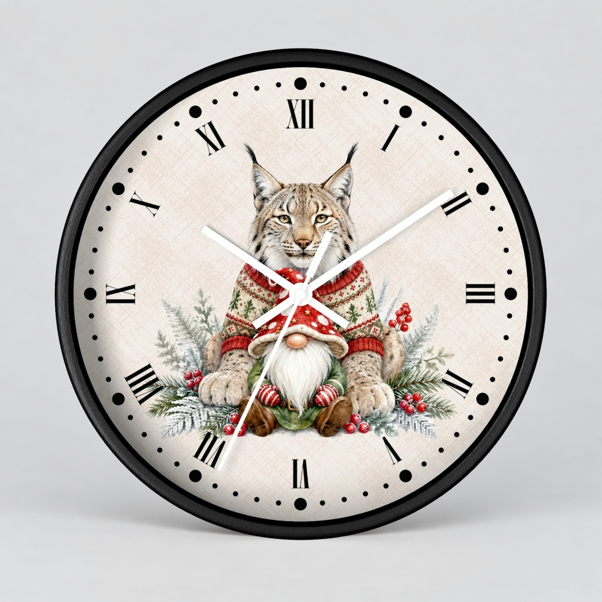 A round wall clock with a black frame and Roman numerals, featuring a detailed illustration of a lynx cat dressed in a red and green Christmas sweater with a small white bearded gnome, set against a light gray background.