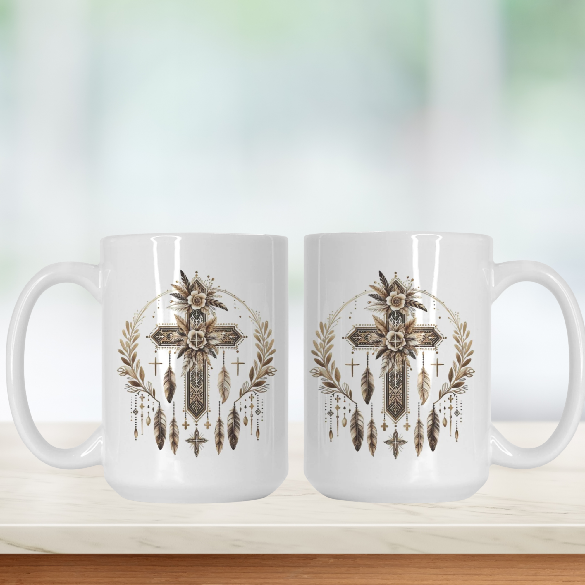 Two white mugs with decorative cross and feather design on a light background