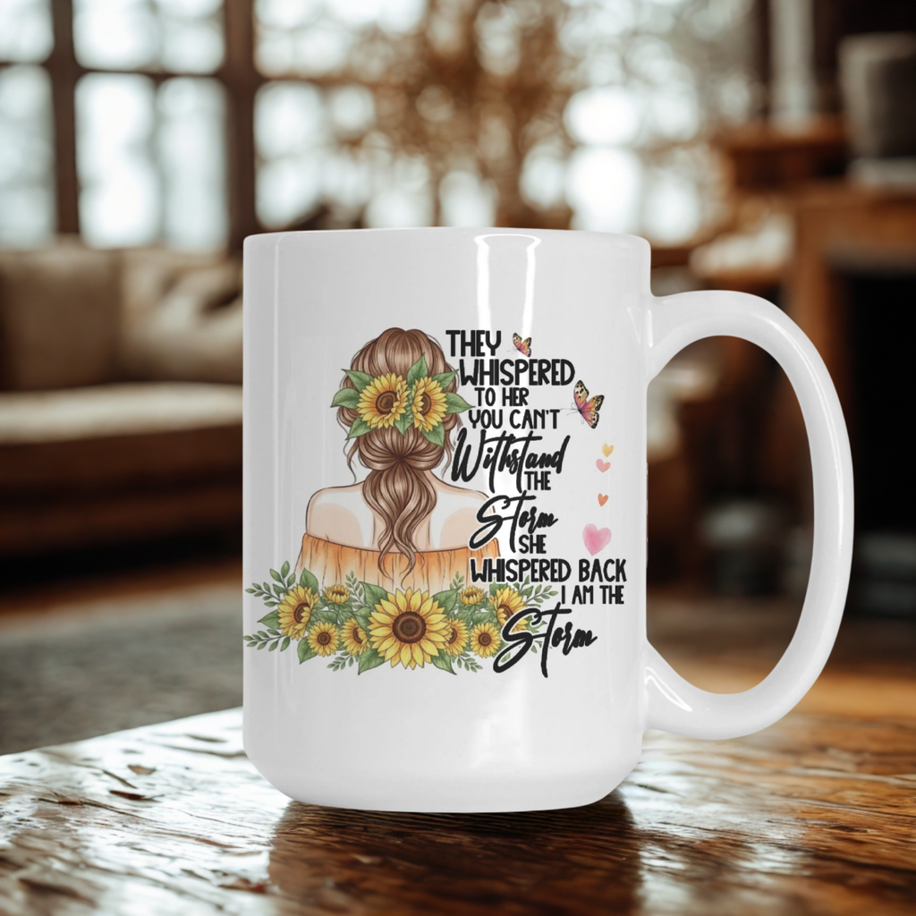 White mug with a design of a woman with flowers in her hair and text, placed on a wooden surface.
