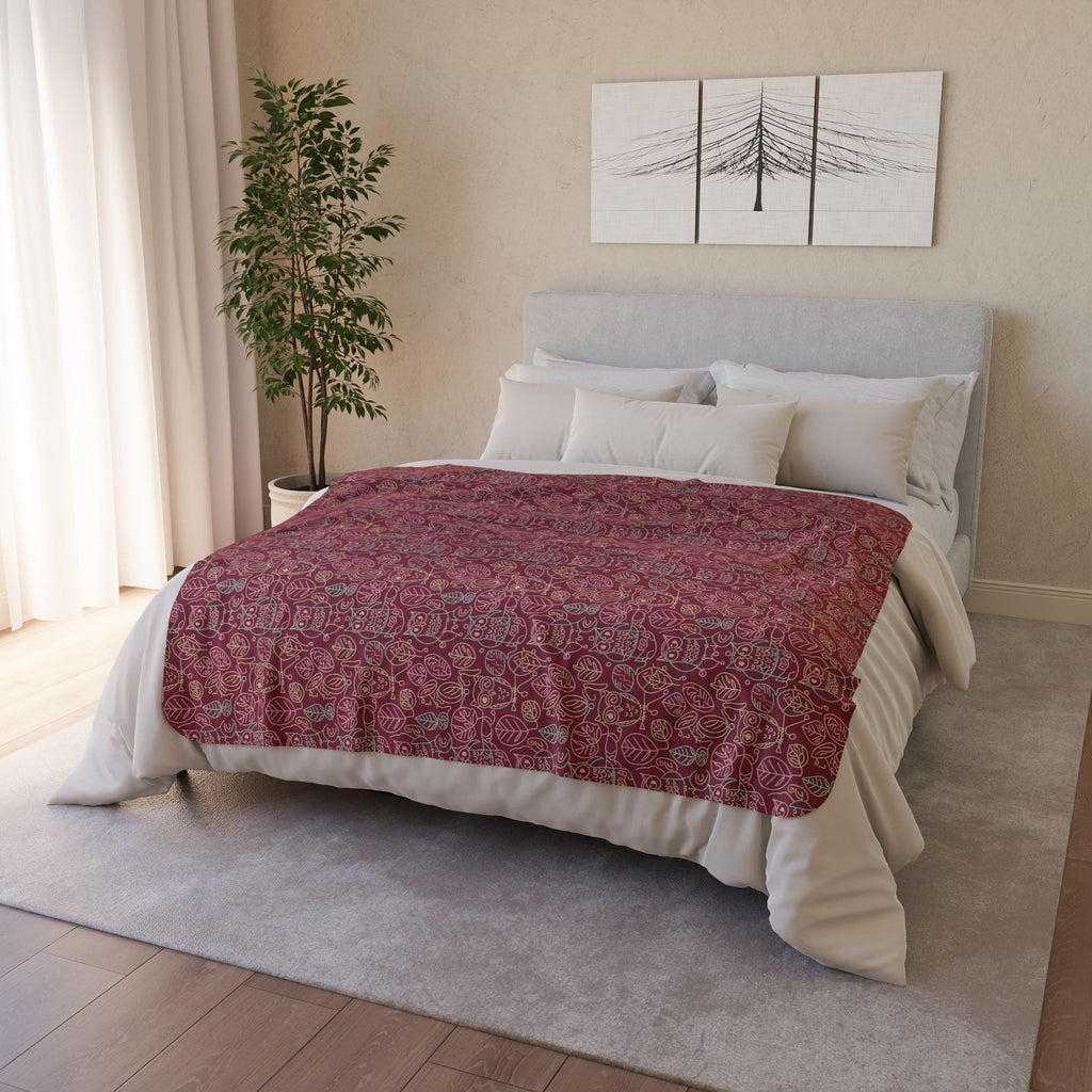 Bedroom with a bed featuring a red 50x60 owl patterned quilt and white bedding.