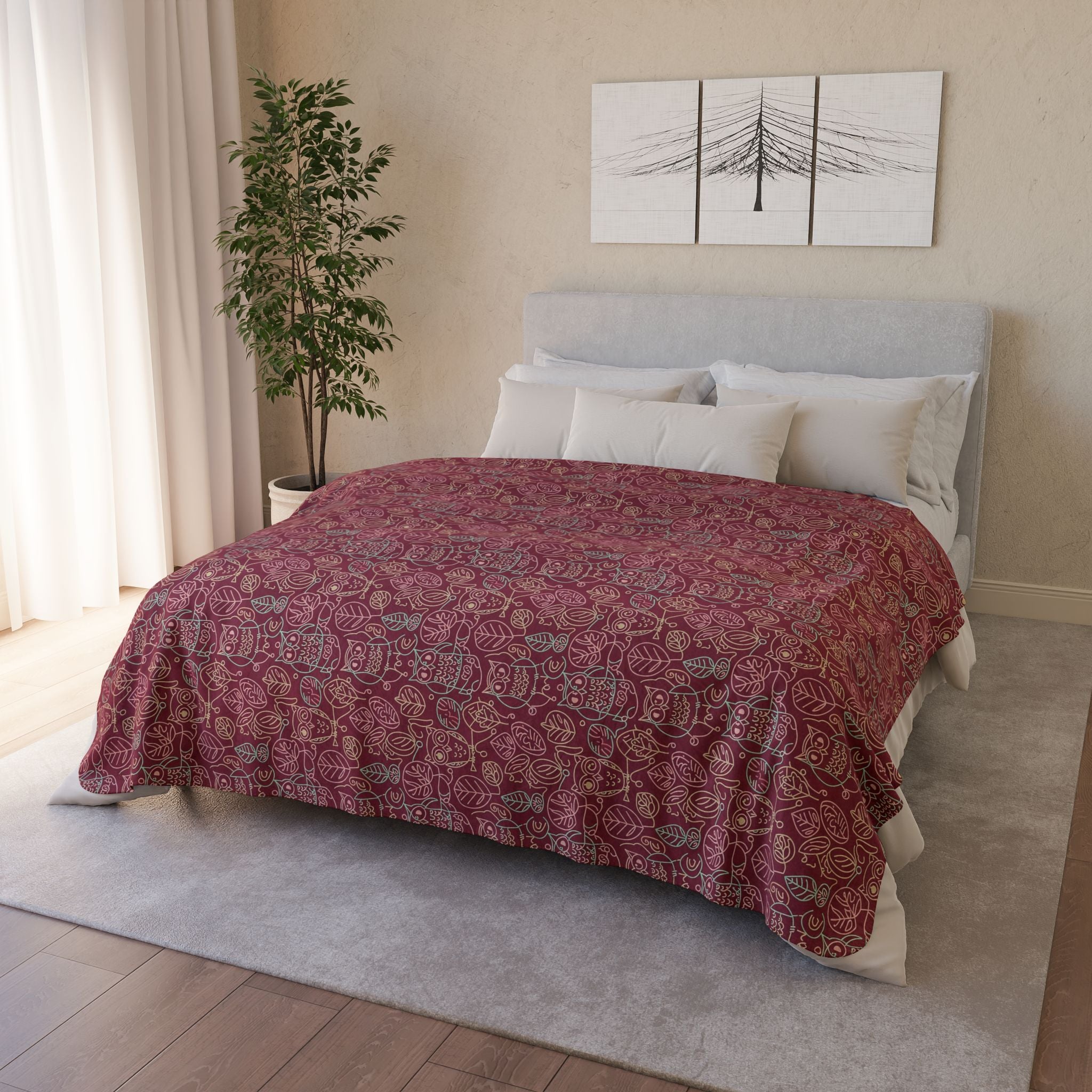 Bedroom with a bed covered in a red 60x 80 owl patterned comforter, white pillows, and a plant.