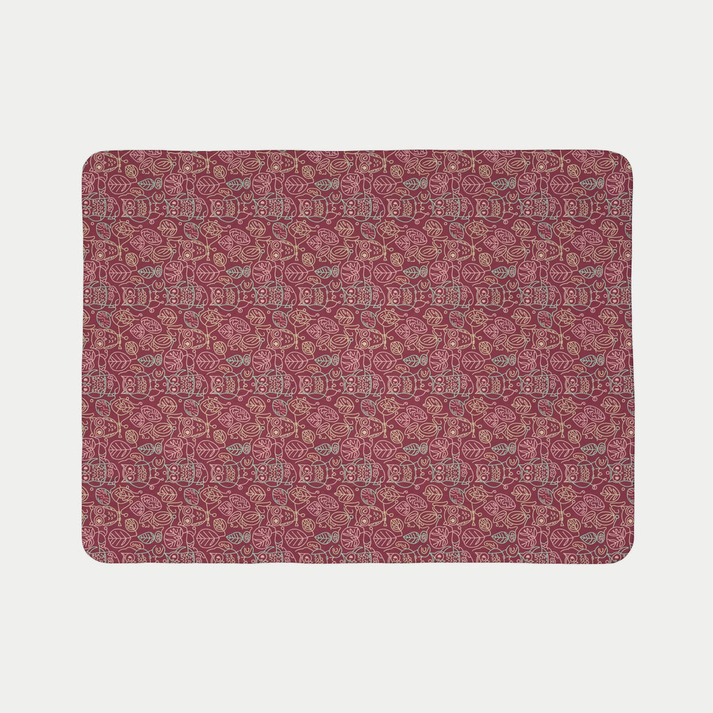 Patterned red blanket on a light gray background