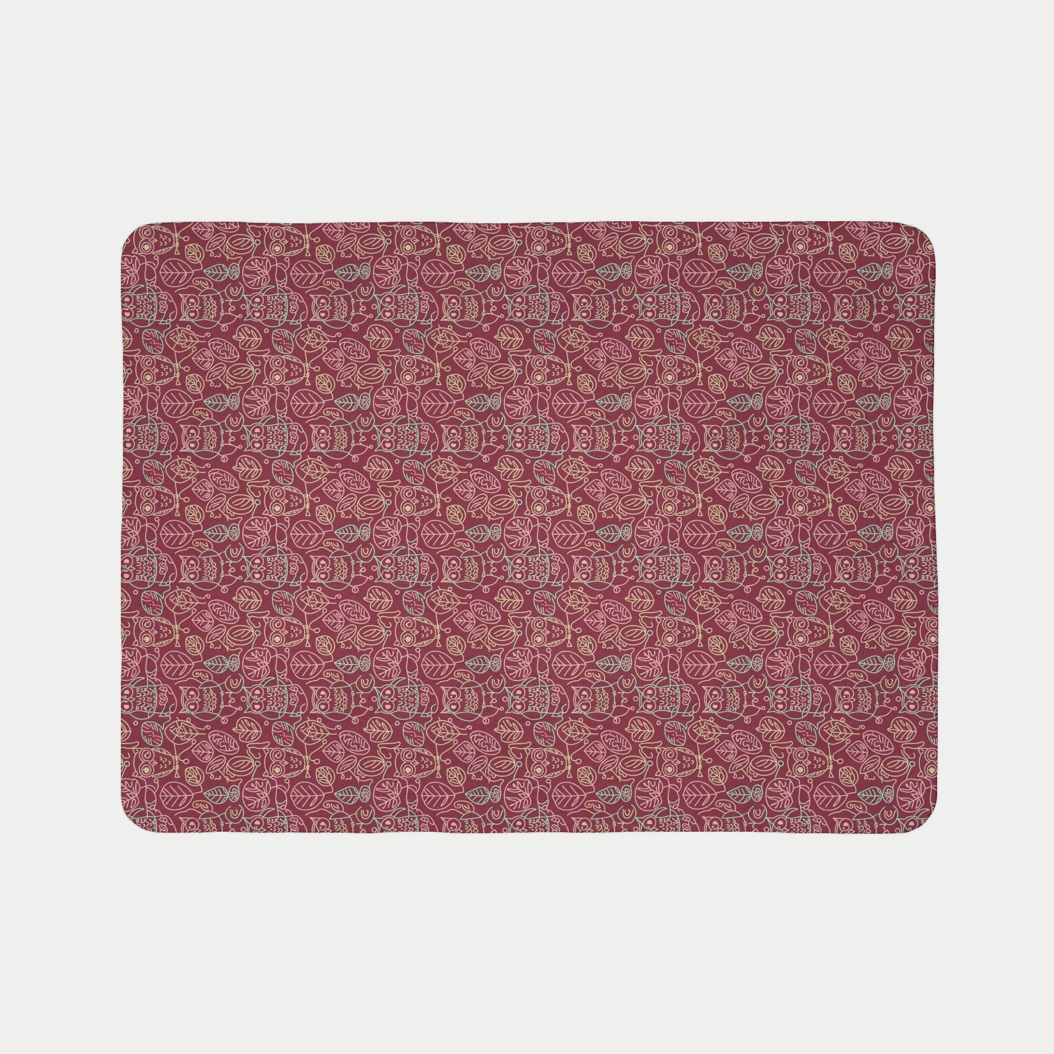 Patterned red blanket on a light gray background
