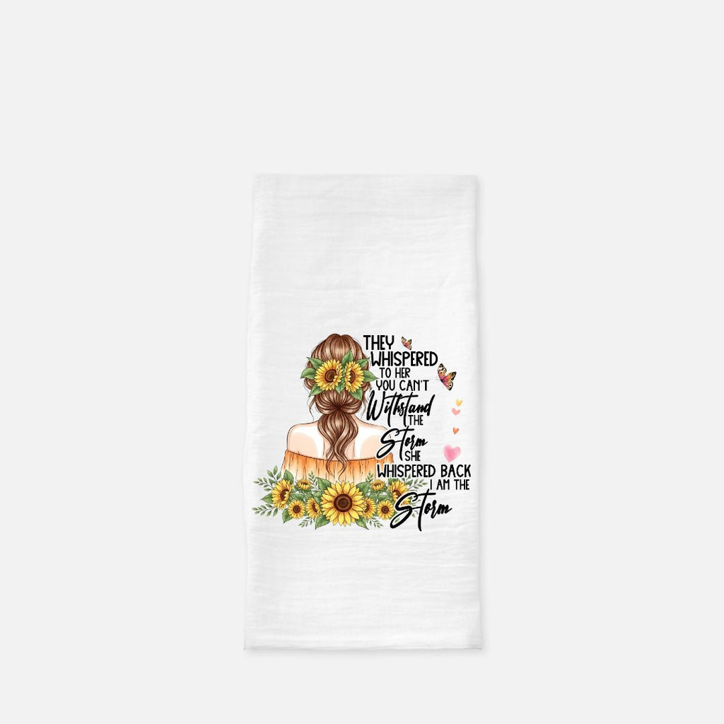 Tea towel with a design of a woman with flowers in her hair and text on a white background