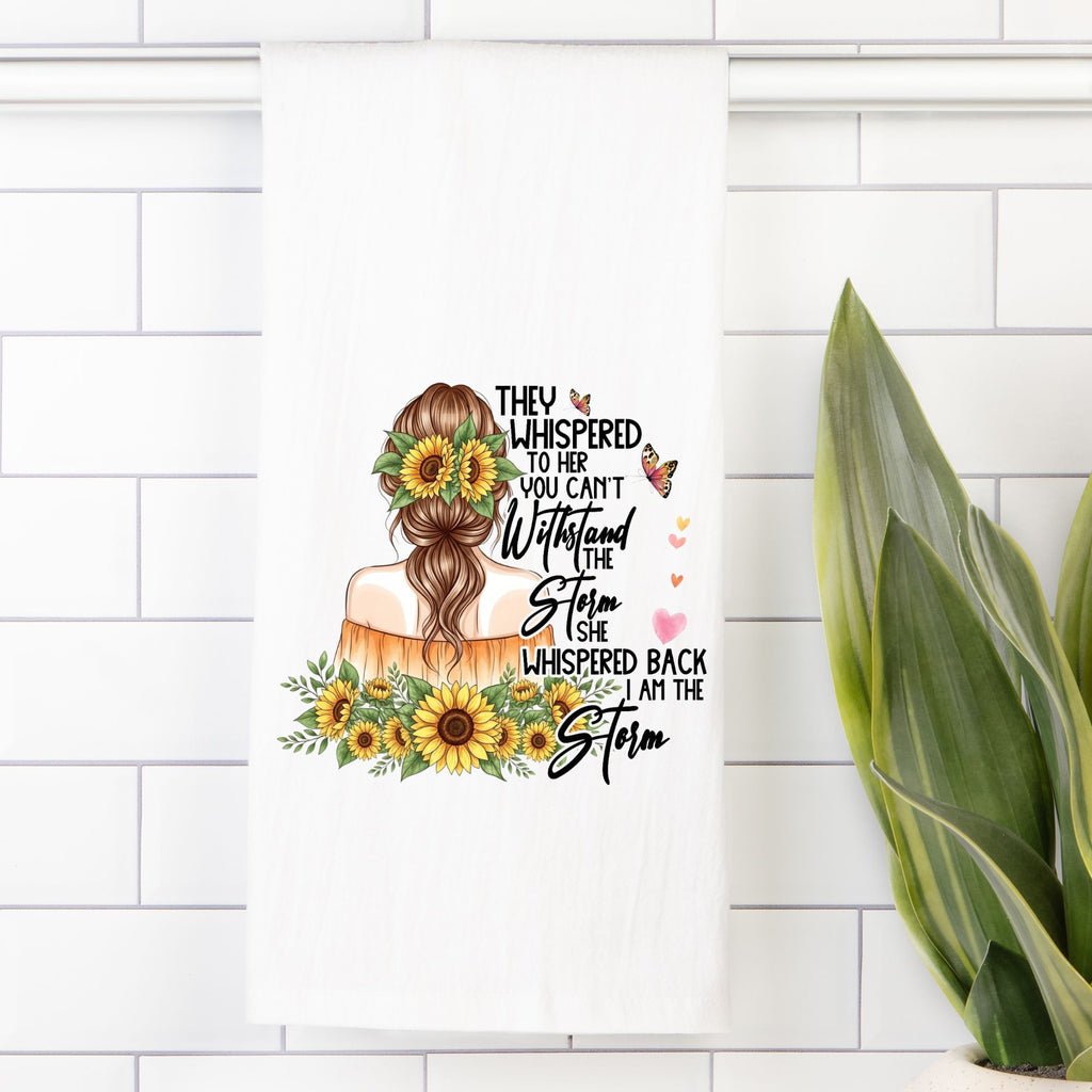 Tea Towel with an illustration of a woman with sunflowers and text on a white tiled wall.