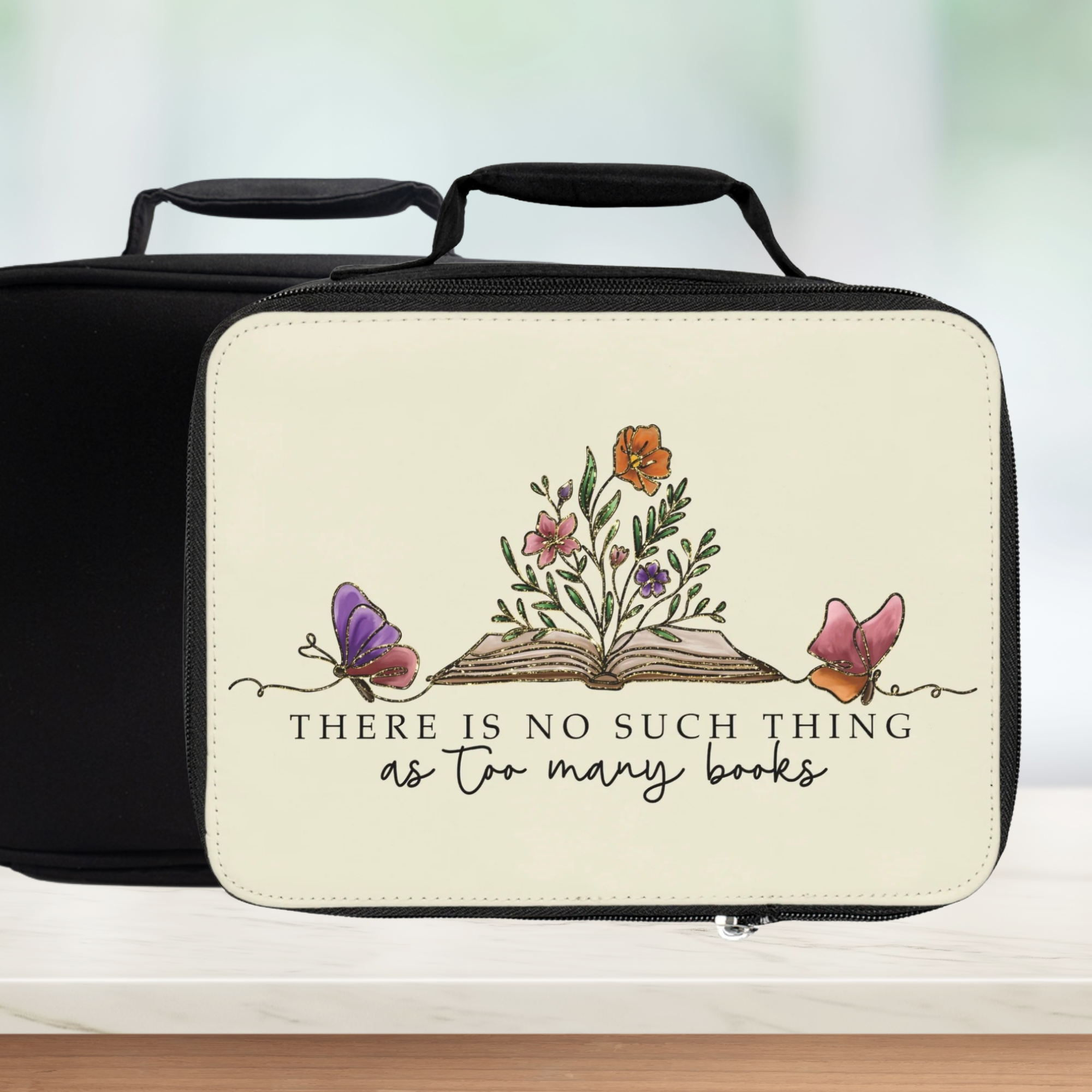 Black lunch bag with floral design and text on a white background