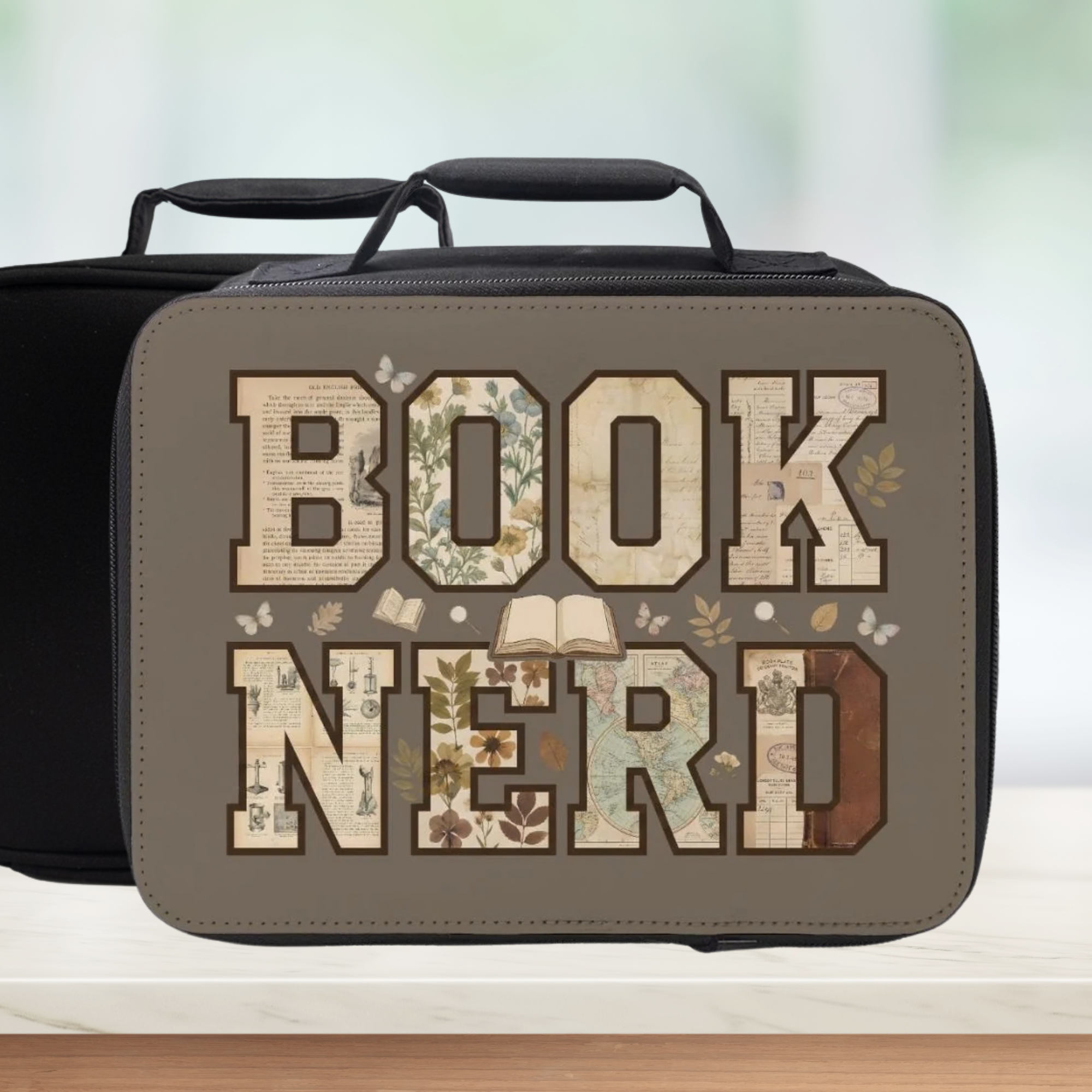 Lunch bag with 'BOOK NERD' text and book-themed design on a neutral background