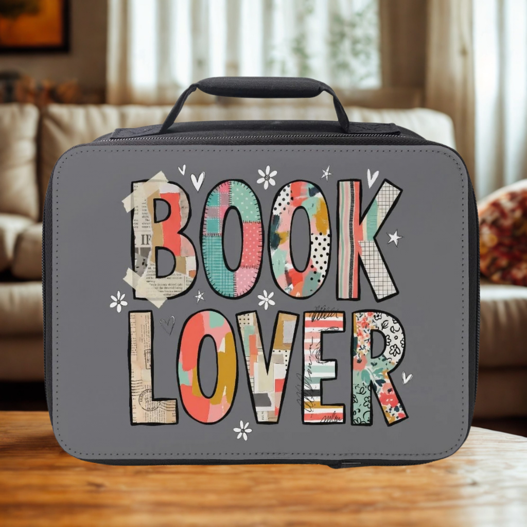 Gray lunch bag with 'BOOK LOVER' text in colorful letters on a wooden surface.