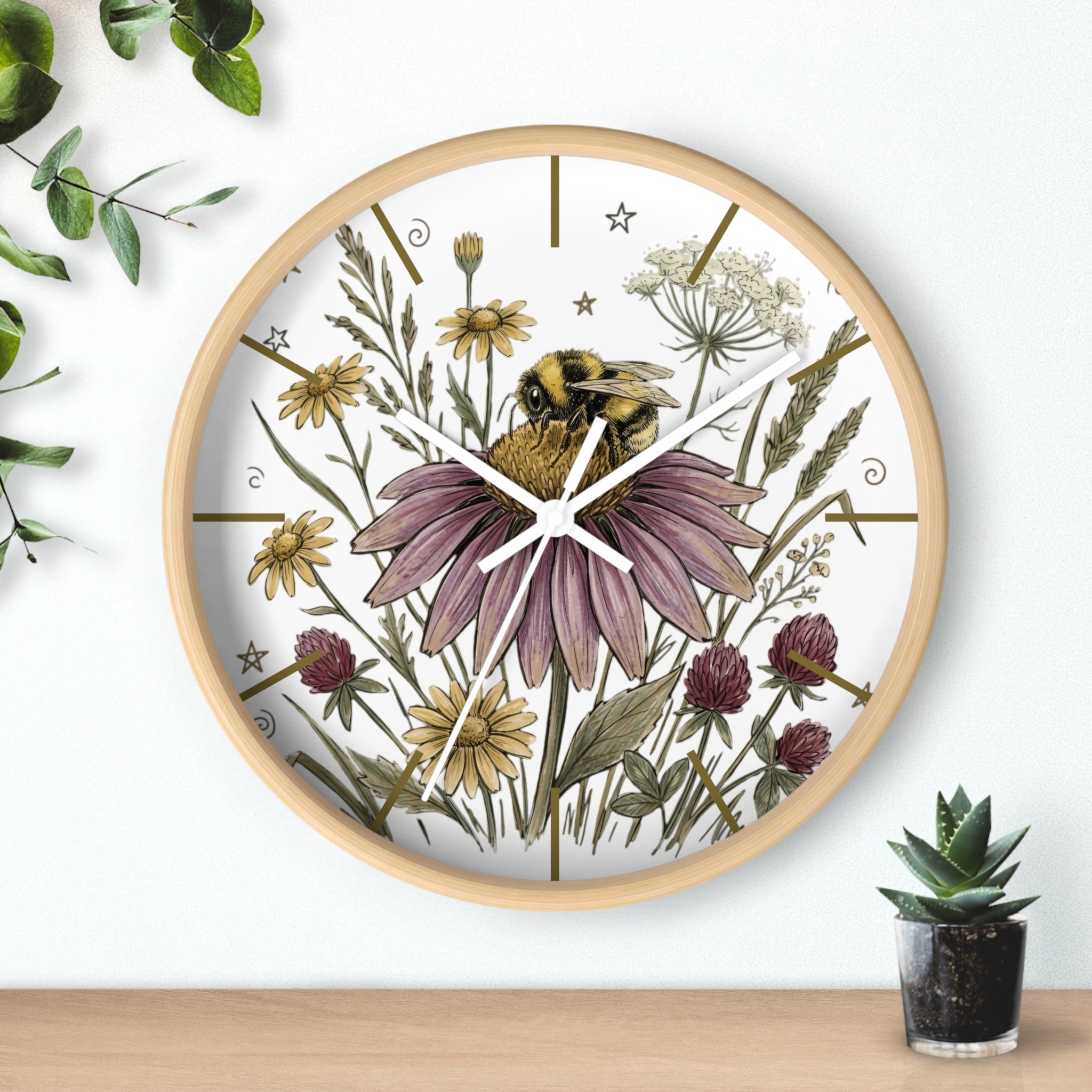 Round wood decorative wall clock with floral and bee design on a white background