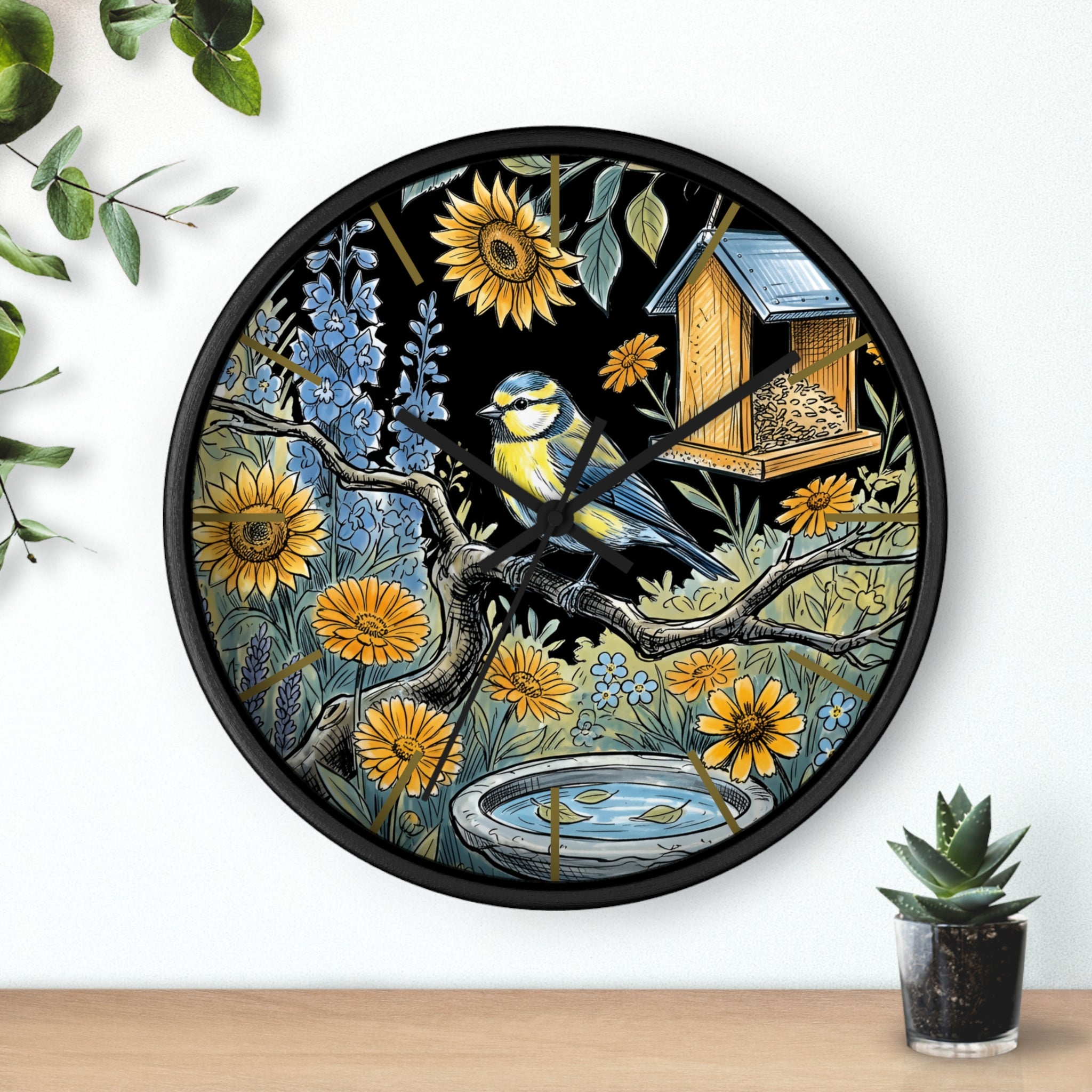 Round black decorative wall clock with a bird and nature design on a white background