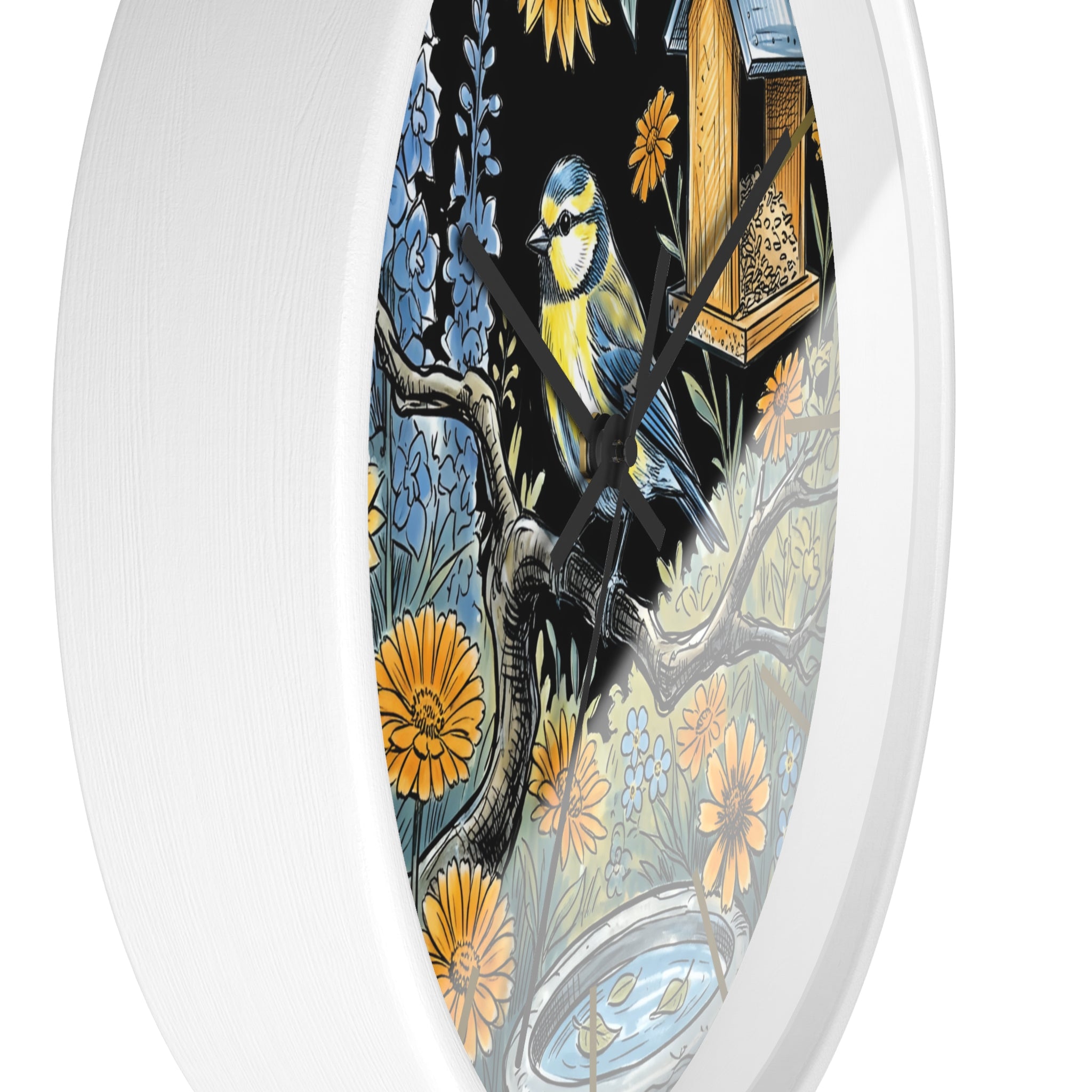 Decorative round white wall clock with black hands and bird and floral design on a white background