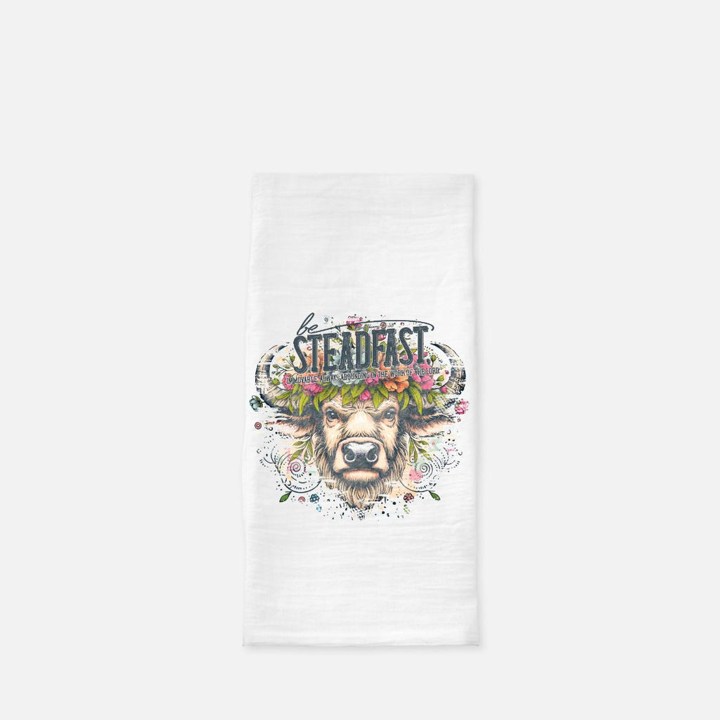 White tea towel with a buffalo graphic and 'Steadfast' text on a white background