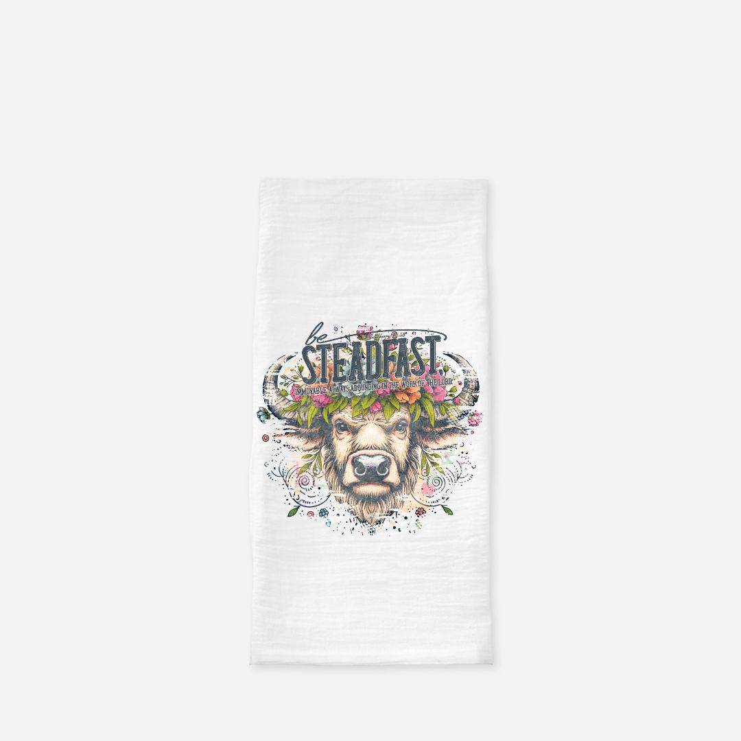 White tea towel with a buffalo graphic and 'Steadfast' text on a white background