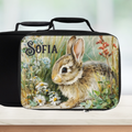 Lunch bag with a rabbit design and 'Sofia' custom text on a blurred background