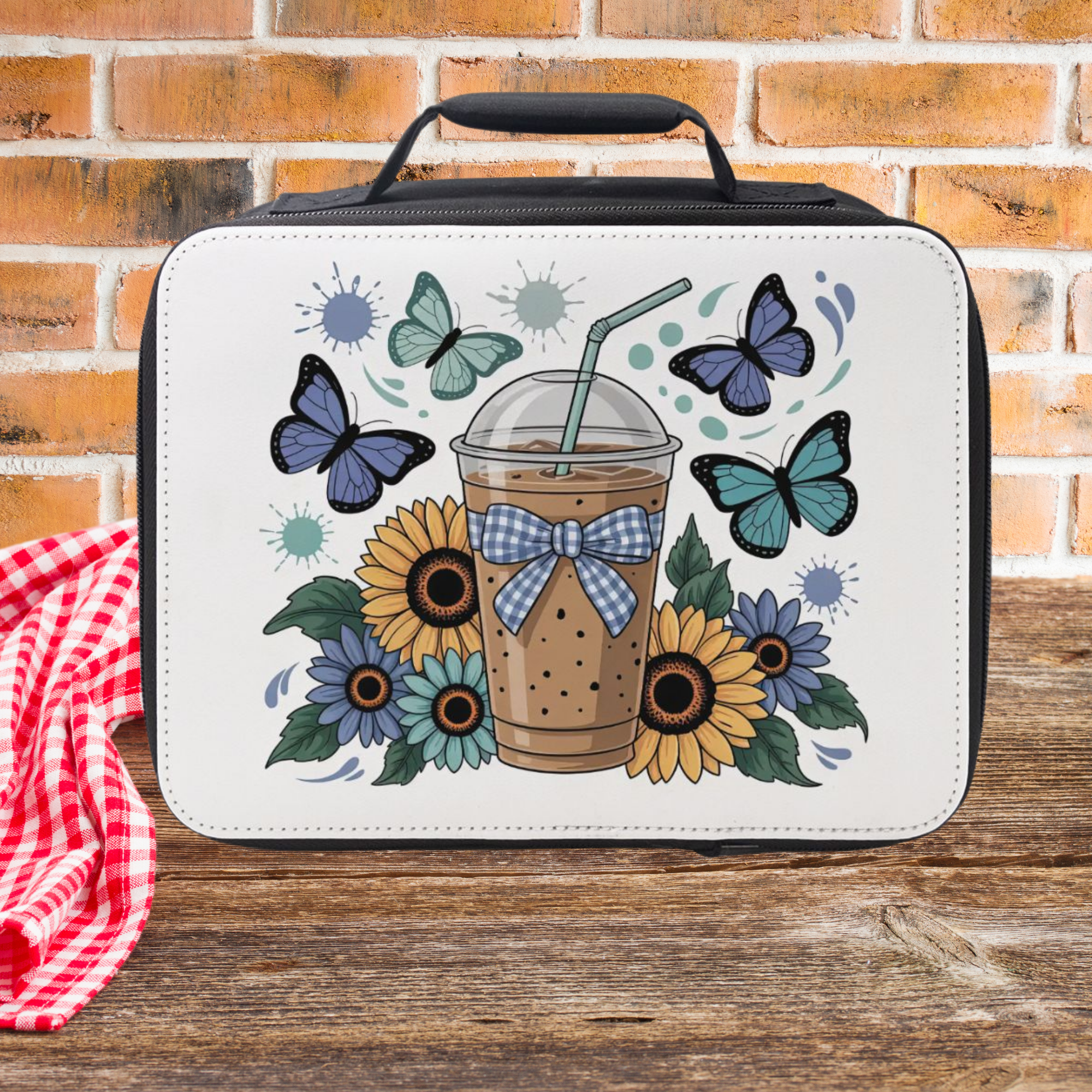 Lunch bag with 'Chicken Mama' design featuring chickens, flowers, and a cross on a wooden picnic table and brick background.