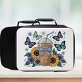 Lunch box with a design of a coffee cup, butterflies, and sunflowers on a white background.