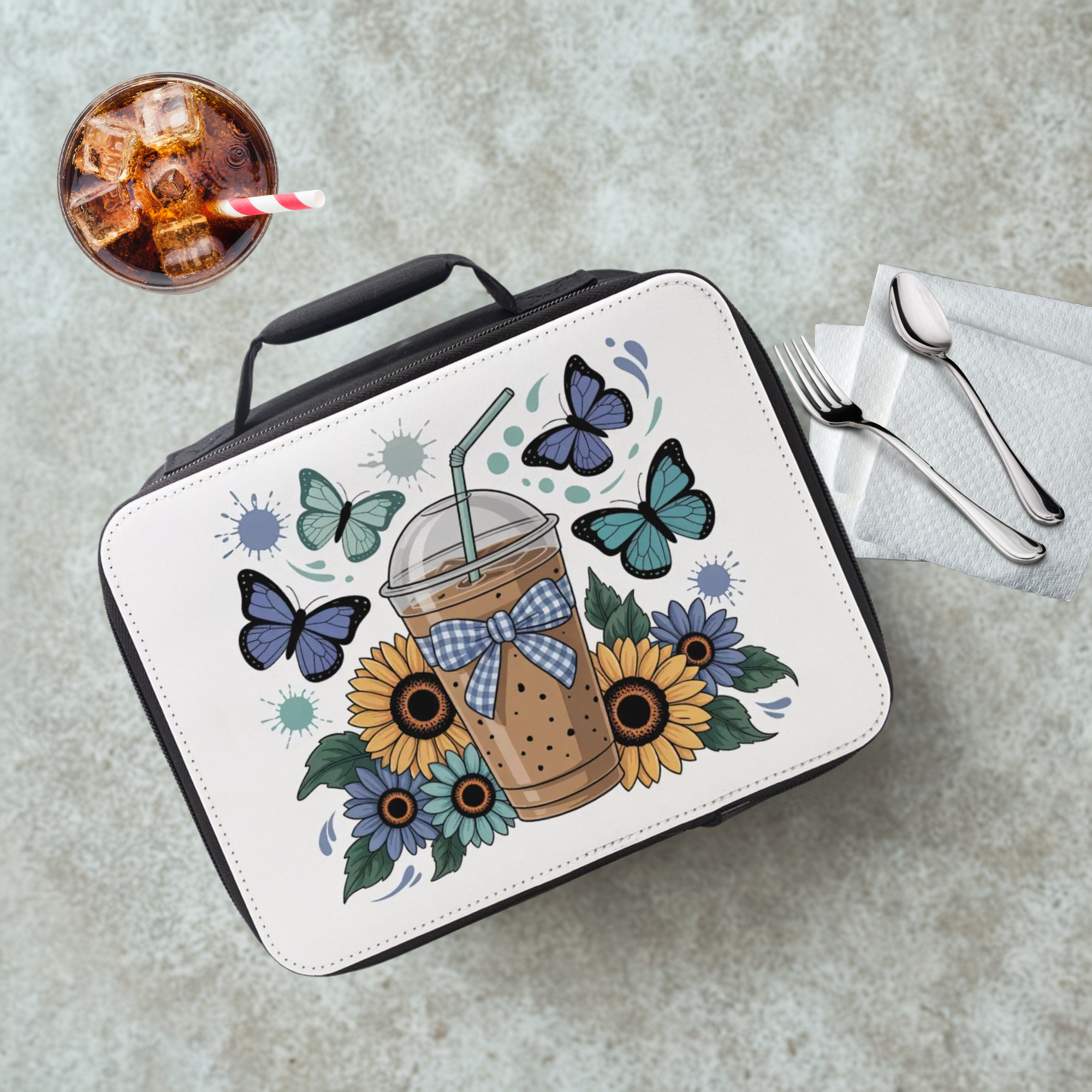  insulated lunch bag with butterfly and sunflower design on a cafeteria table