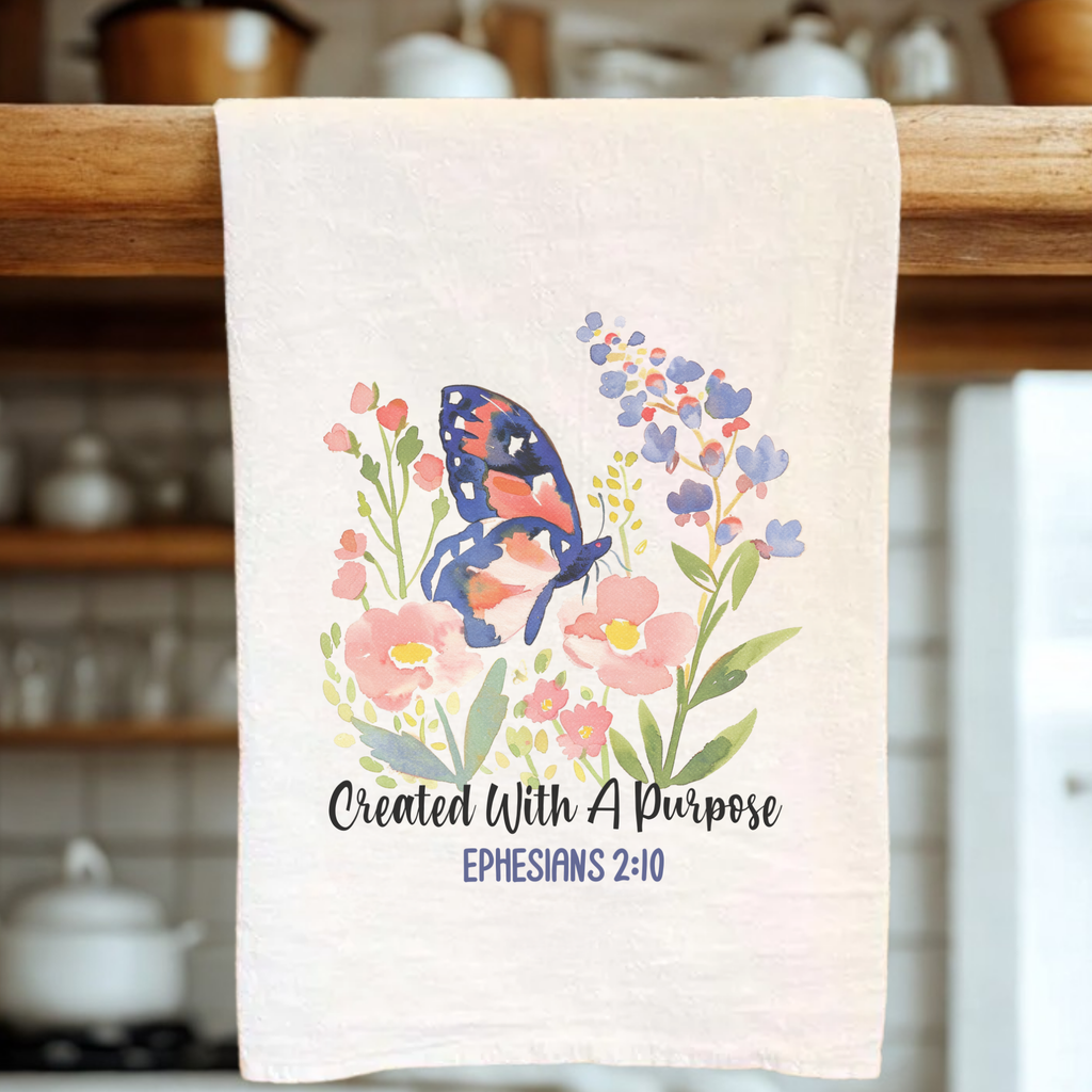 Decorative tea towel with butterfly and floral design in a kitchen setting